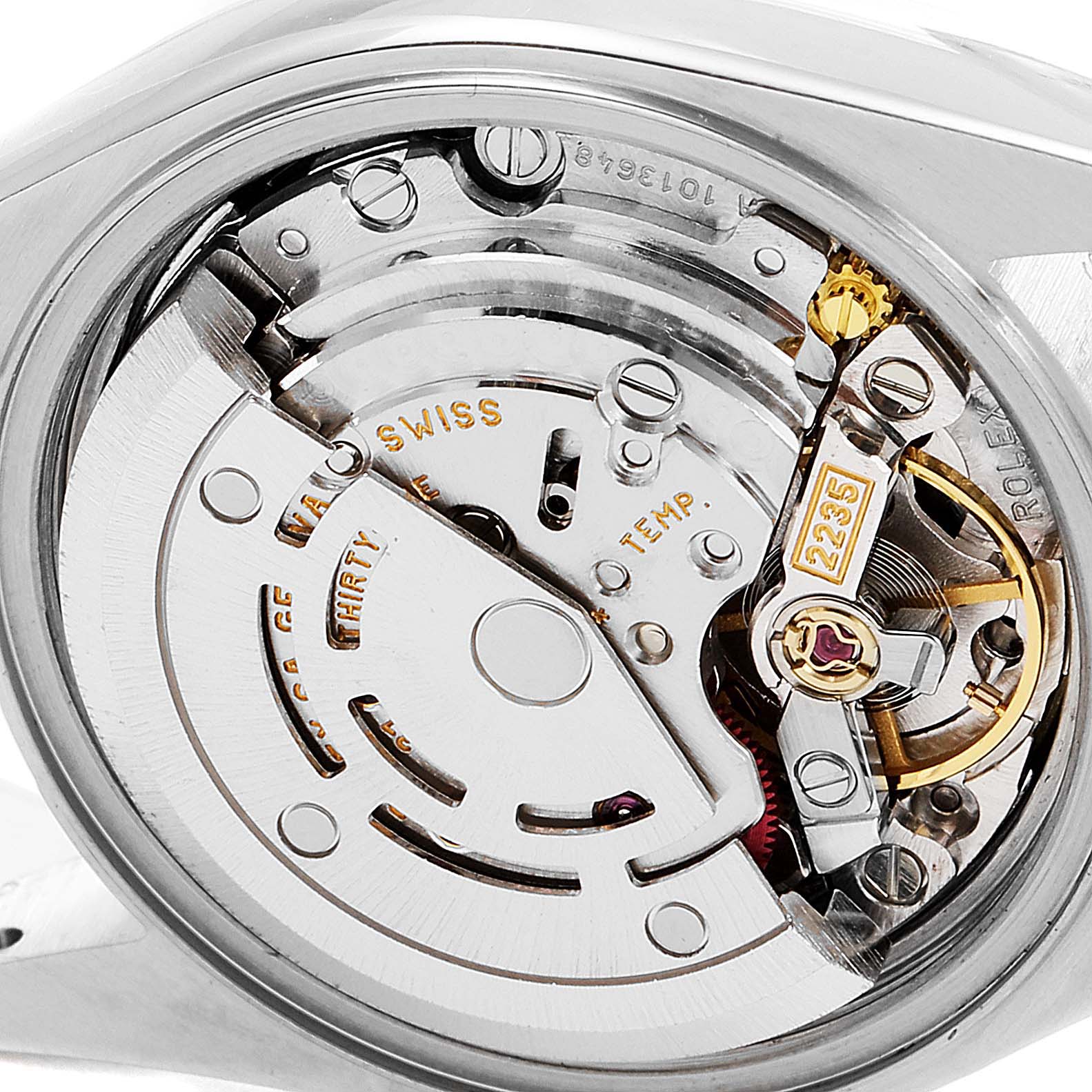 This image shows a close-up of the movement of a Rolex Datejust 79173 Women's Steel and Gold (two tone) Champagne Dial 79173 Women's Steel and Gold (two tone) Champagne Dial watch, highlighting its internal mechanical components.