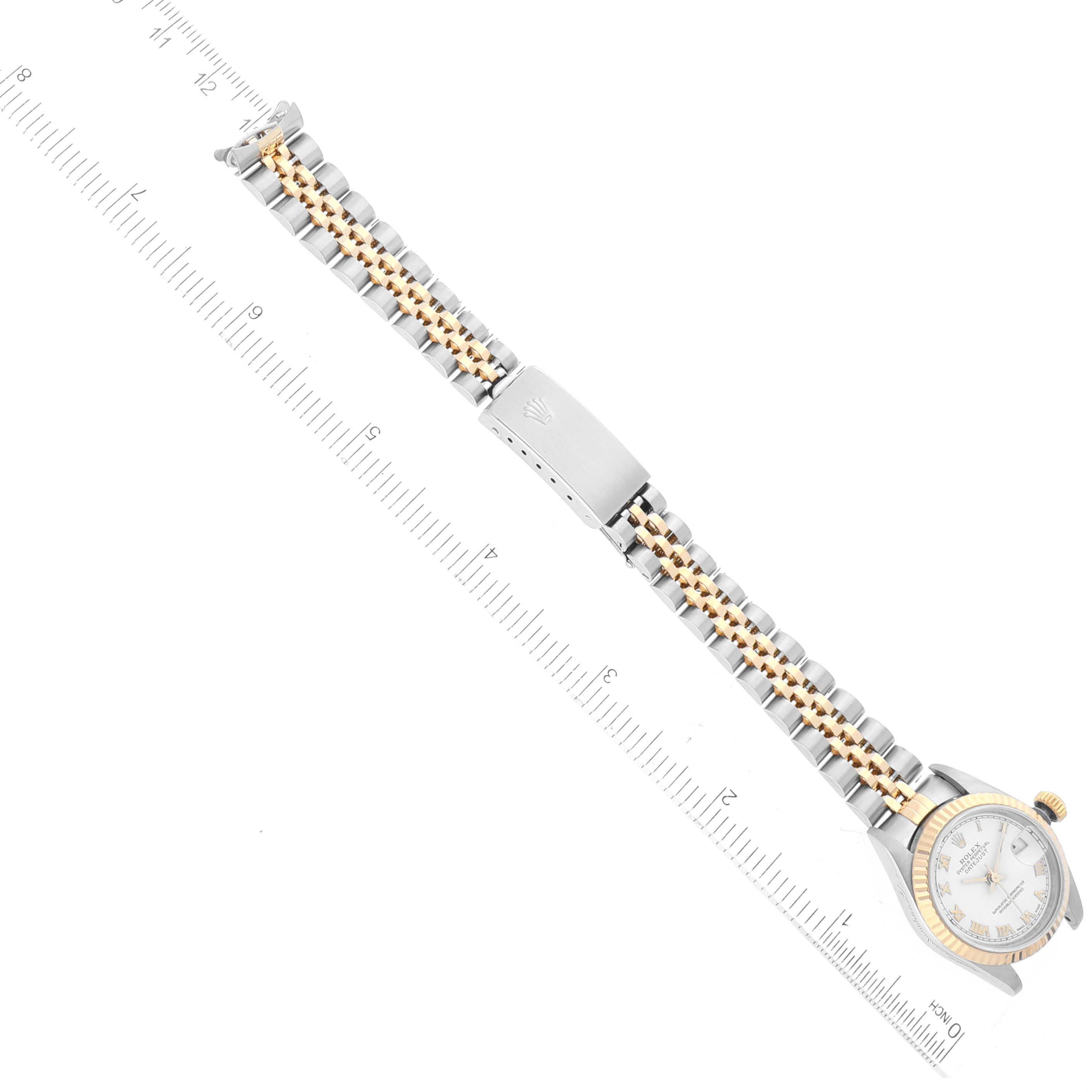 The image shows a Rolex Datejust 79173 Women's Steel and Gold (two tone) White Dial 79173 Women's Steel and Gold (two tone) White Dial watch from a top-down angle, displaying the entire watch band and the watch face.