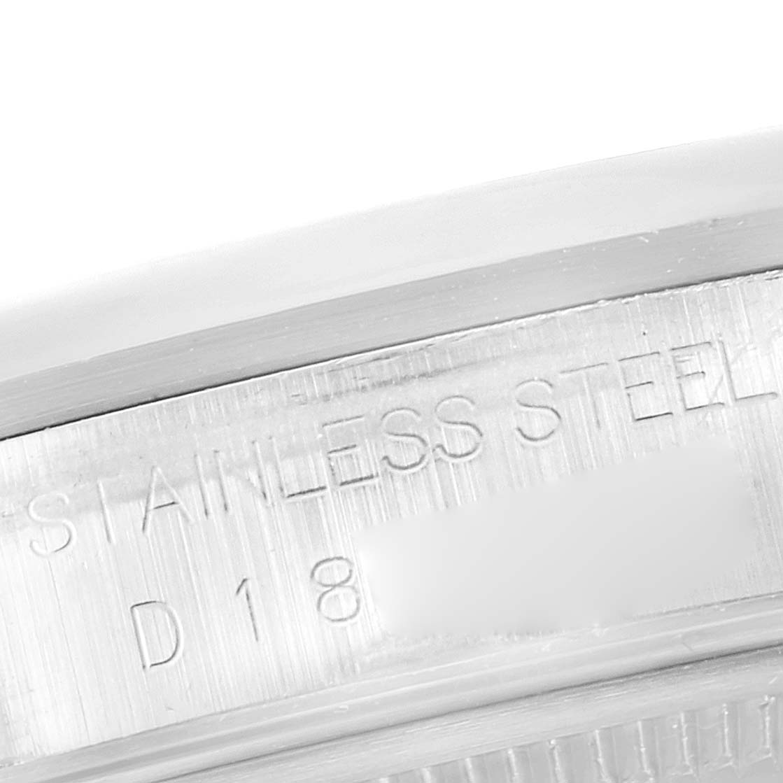 This image shows a close-up angle of the stainless steel inner bezel of a Rolex Datejust 16200 Men's Stainless Steel White Dial 16200 Men's Stainless Steel White Dial watch.