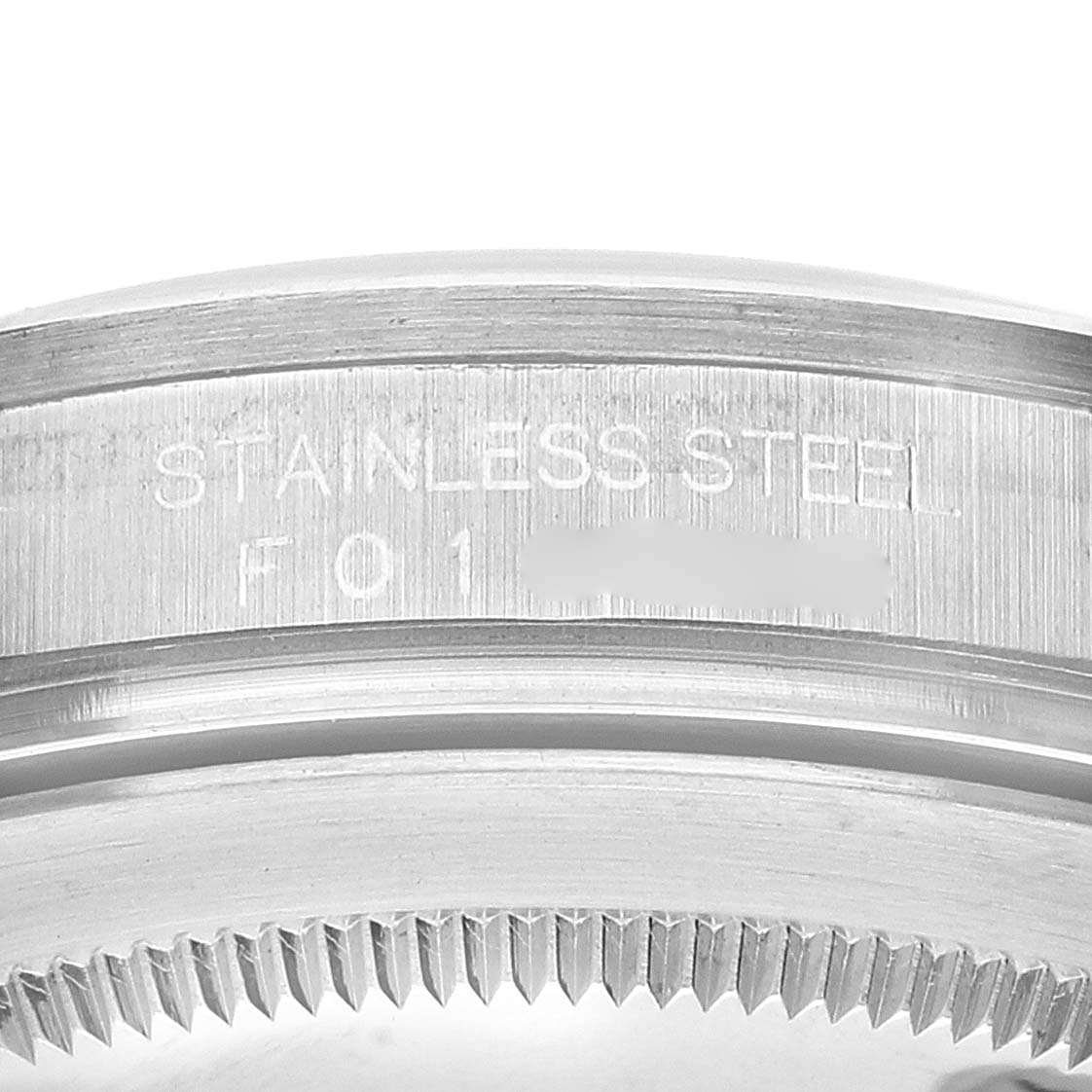 The image shows a close-up of the stainless-steel case back of a Rolex Explorer 16570 Men
s Stainless Steel White Dial 16570 Men
s Stainless Steel White Dial watch.