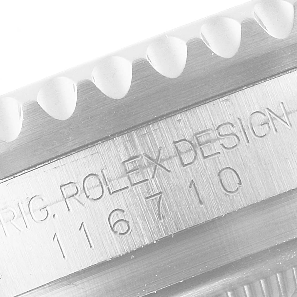 The image shows a close-up of the engraved side and bezel teeth of the Rolex GMT-Master 116710 Men
s Stainless Steel Black Dial 116710 Men
s Stainless Steel Black Dial model.