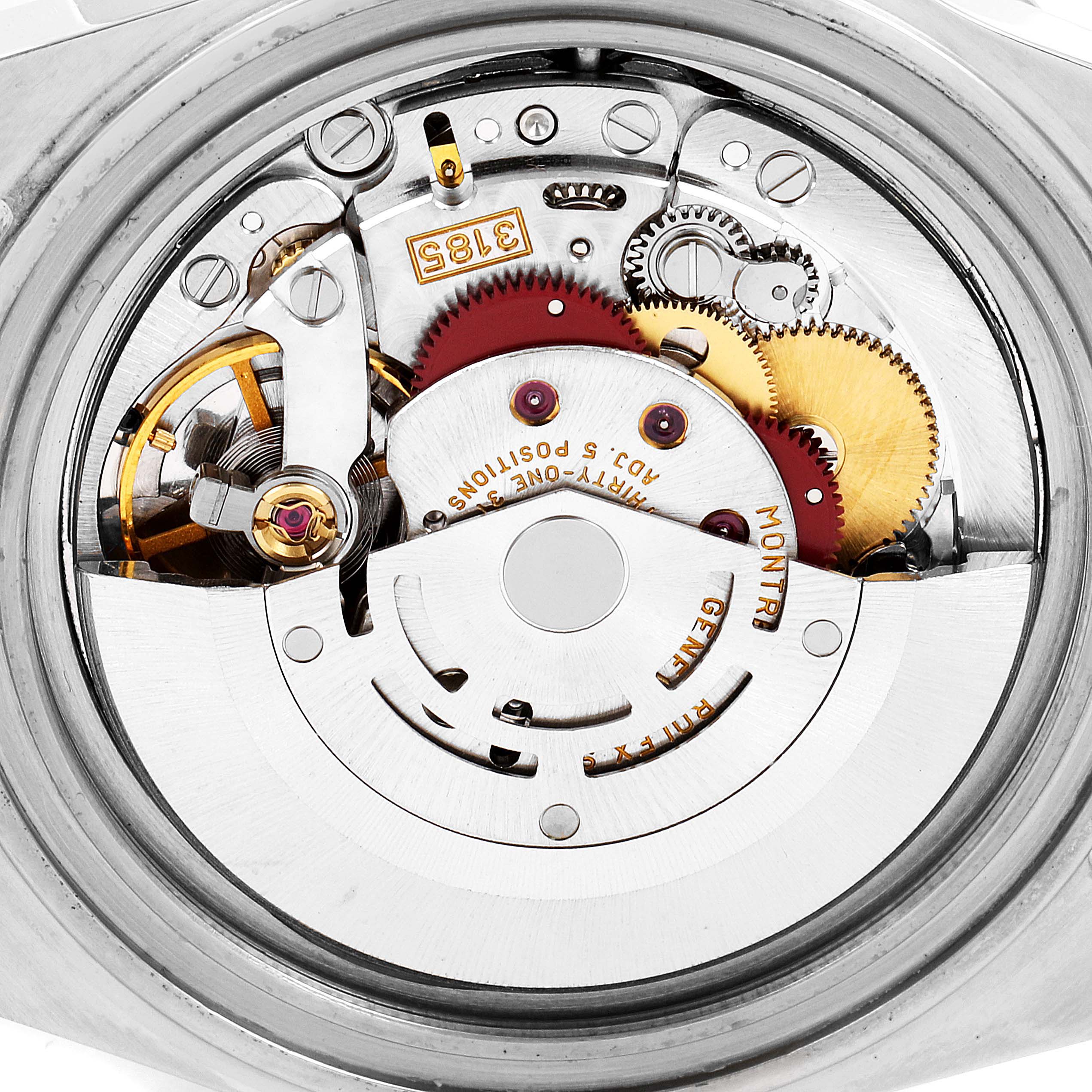 This image shows the intricate internal mechanism of a Rolex GMT-Master 16713 Men's Steel and Gold (two tone) Black Dial 16713 Men's Steel and Gold (two tone) Black Dial watch from a close-up, top-down angle.