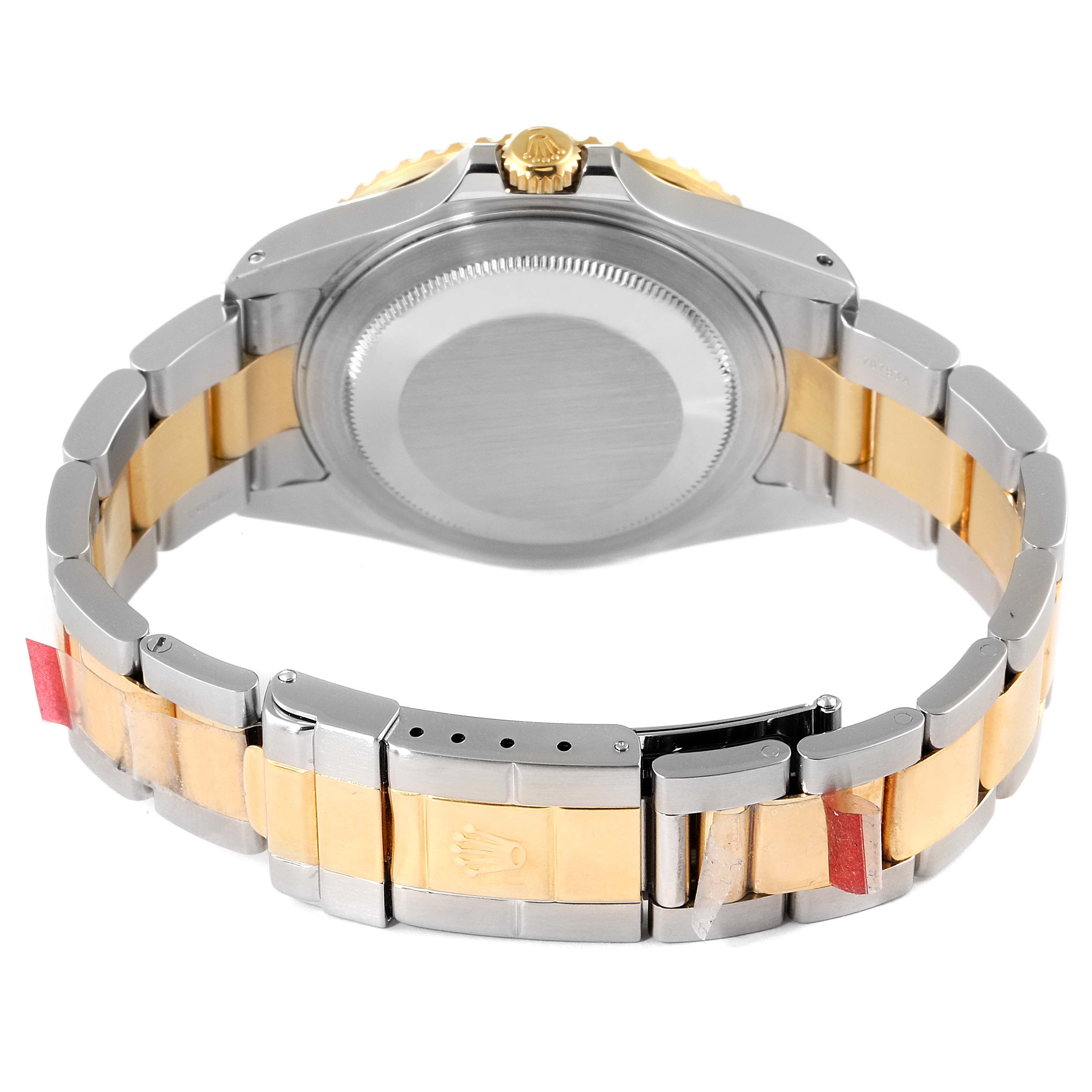 This image shows the back case and two-tone bracelet of the Rolex GMT-Master 16713 Men's Steel and Gold (two tone) Black Dial 16713 Men's Steel and Gold (two tone) Black Dial watch.