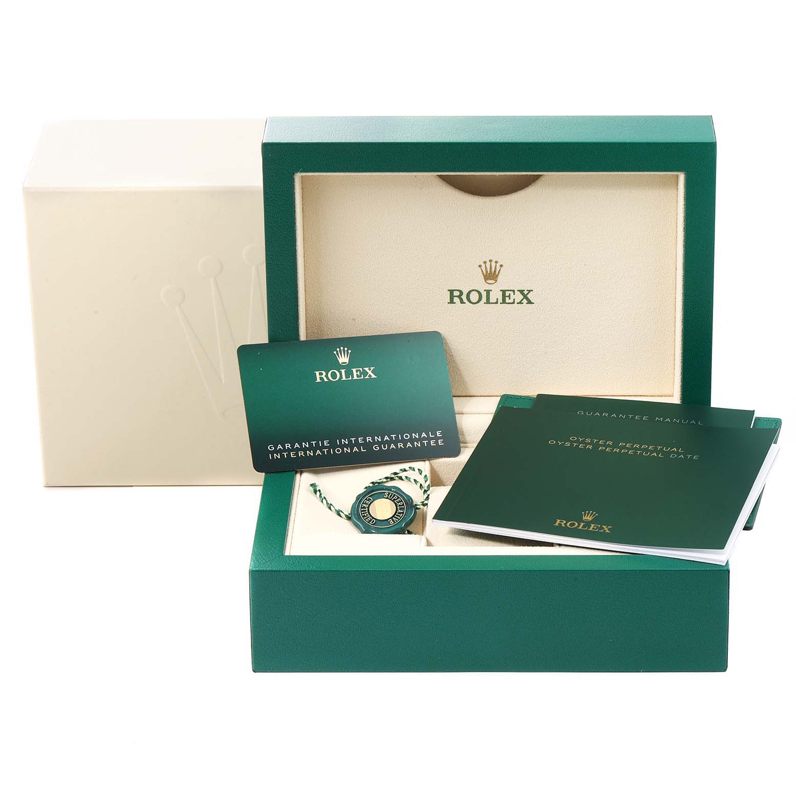The image shows a Rolex Oyster Perpetual 126000 Men
s Stainless Steel Black Dial 126000 Men
s Stainless Steel Black Dial watch box with manuals, a guarantee card, and a tag, viewed from the front.