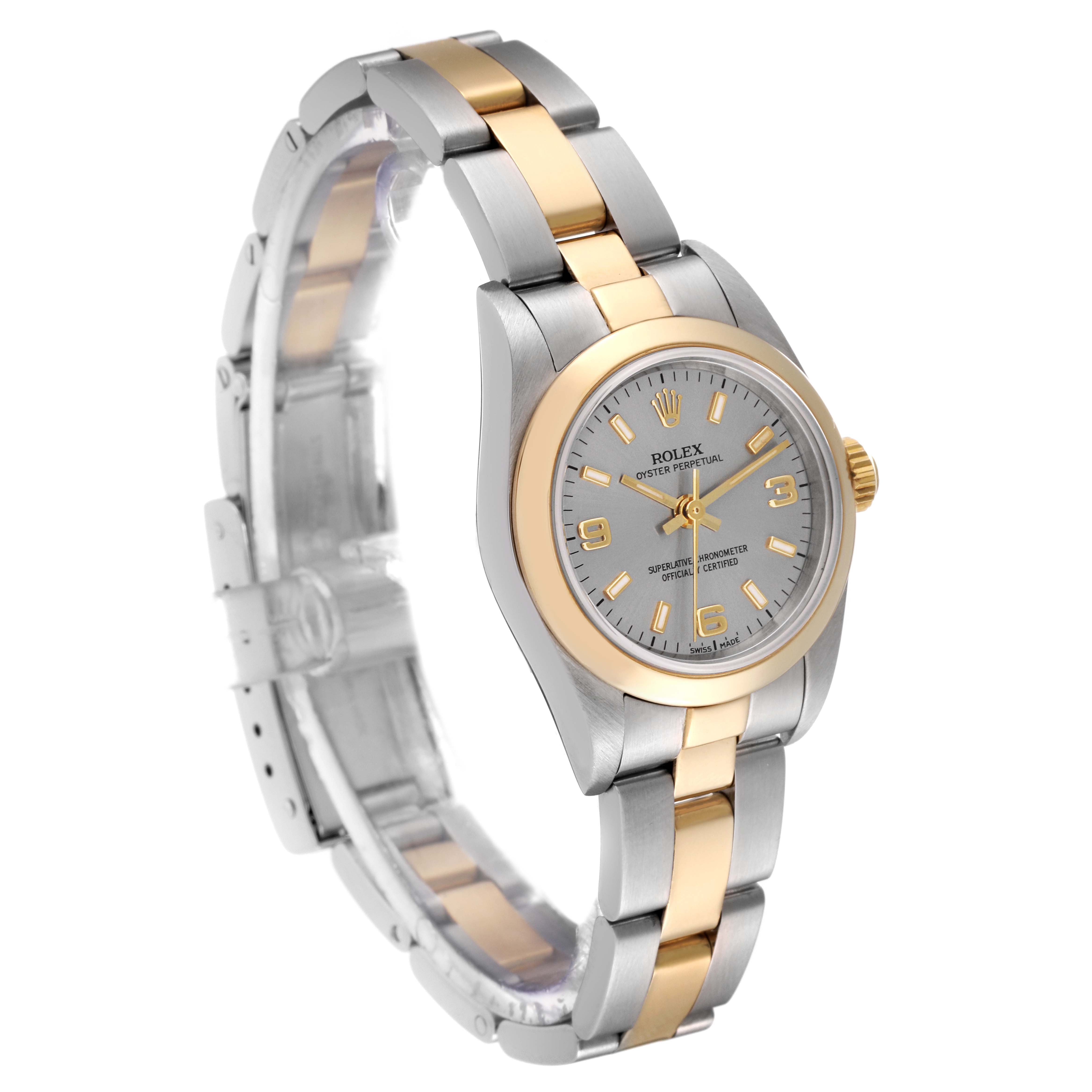 This Rolex Oyster Perpetual 76183 Women's Steel and Gold (two tone) Grey Dial 76183 Women's Steel and Gold (two tone) Grey Dial watch is shown at an oblique angle, highlighting the bicolored bracelet and dial.