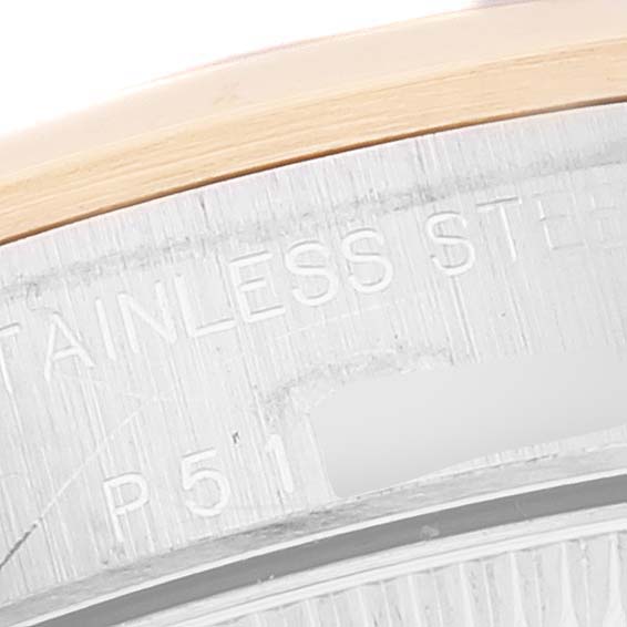 This image shows a close-up of the side engraving on a Rolex Oyster Perpetual 76183 Women's Steel and Gold (two tone) Grey Dial 76183 Women's Steel and Gold (two tone) Grey Dial watch.