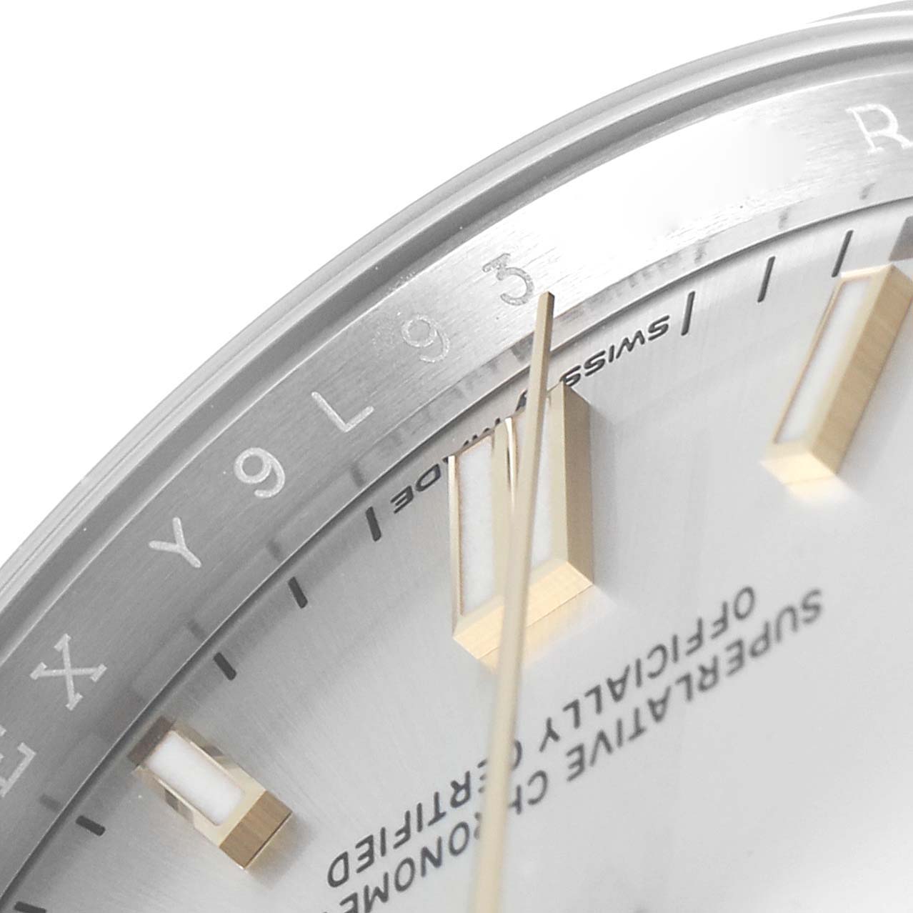 This close-up image shows the dial, hour markers, and part of the bezel of a Rolex Oyster Perpetual 126000 Men's Stainless Steel Silver Dial 126000 Men's Stainless Steel Silver Dial watch.