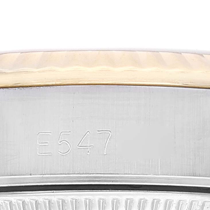 This image shows a close-up view of the case side and part of the bezel of a Rolex Oyster Perpetual 67193 Women's Steel and Gold (two tone) Champagne Dial 67193 Women's Steel and Gold (two tone) Champagne Dial watch.