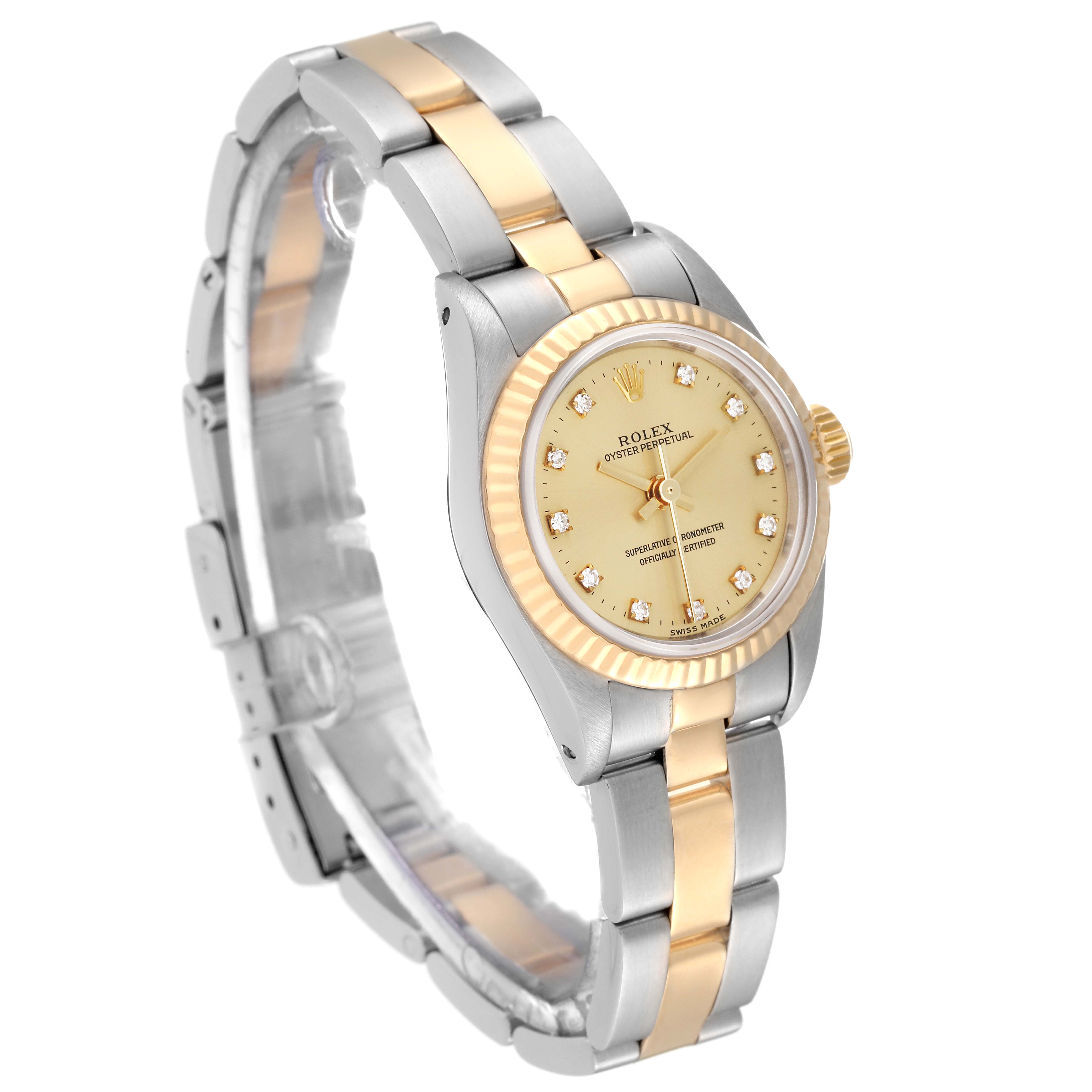 This image shows a Rolex Oyster Perpetual 67193 Women's Steel and Gold (two tone) Champagne Dial 67193 Women's Steel and Gold (two tone) Champagne Dial watch at an angle displaying the dial, bezel, case, and bracelet.