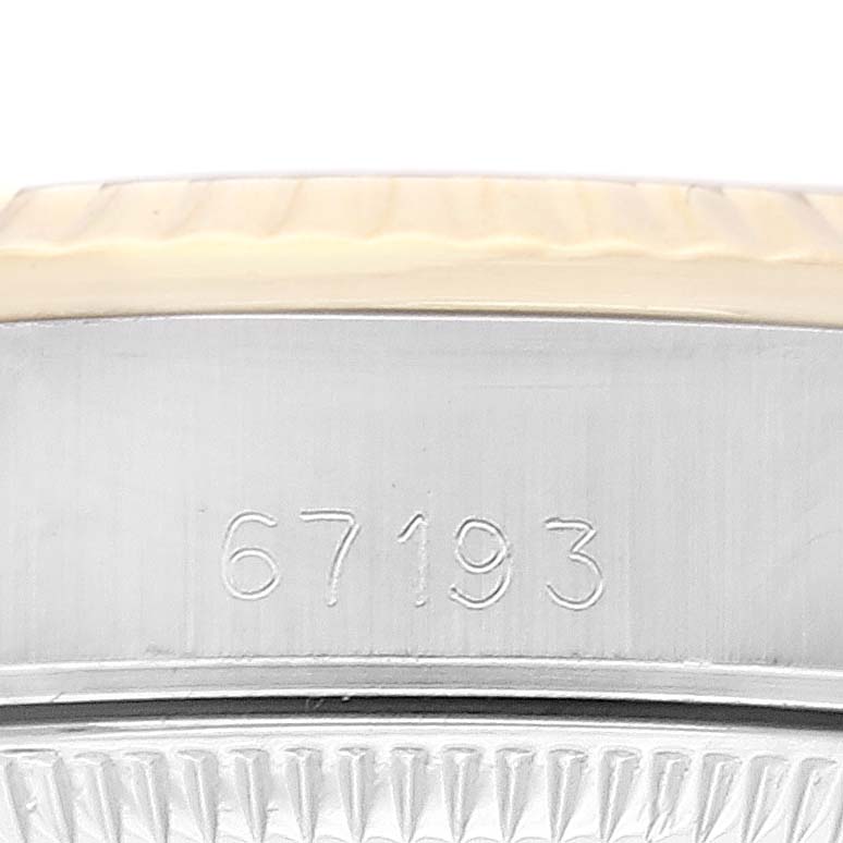 The image shows a close-up of the engraved case side of an Oyster Perpetual Rolex watch, displaying the model number "67193."
