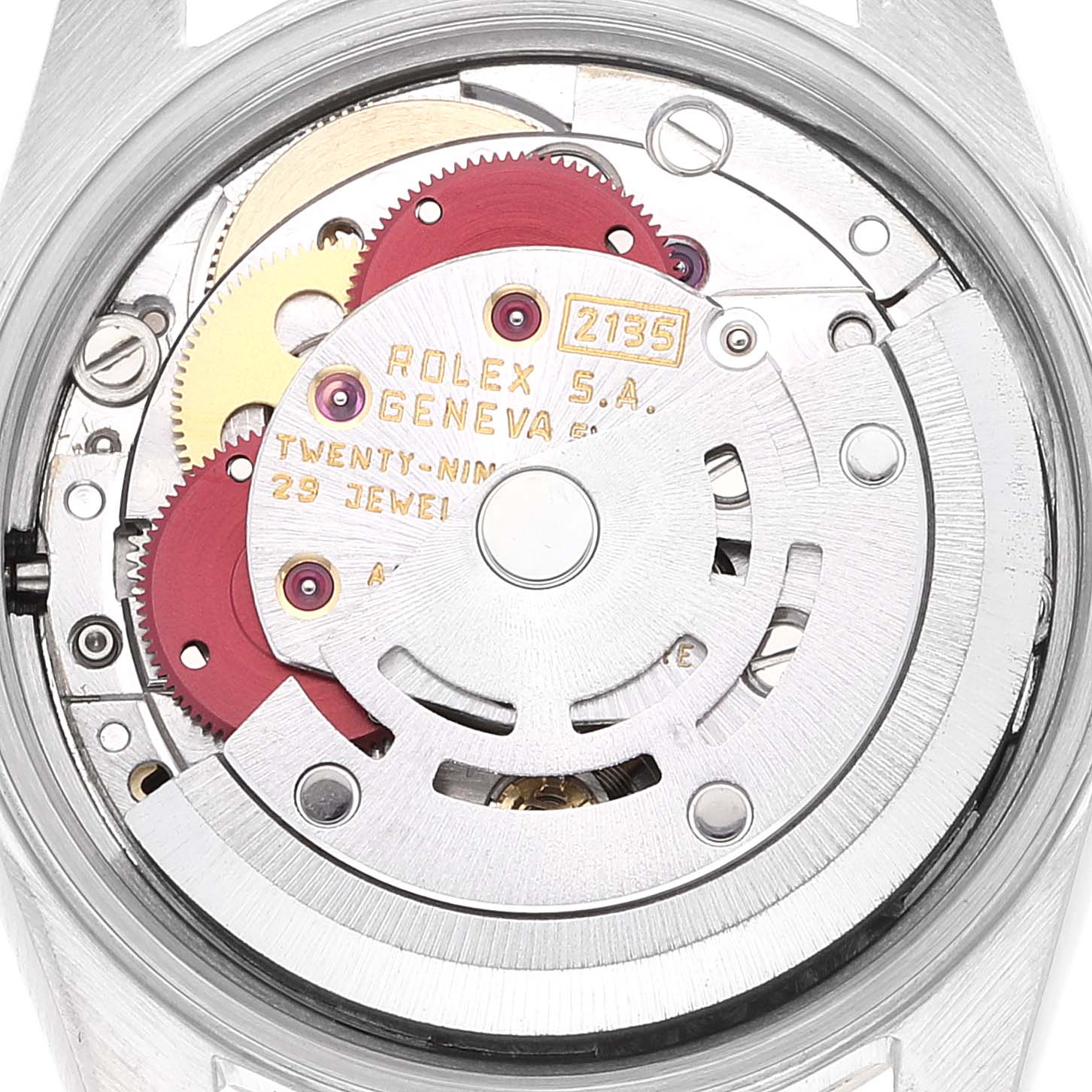 This image shows the internal mechanism of the Rolex Oyster Perpetual 67193 Women's Steel and Gold (two tone) Champagne Dial 67193 Women's Steel and Gold (two tone) Champagne Dial watch, highlighting its intricate gears and components.