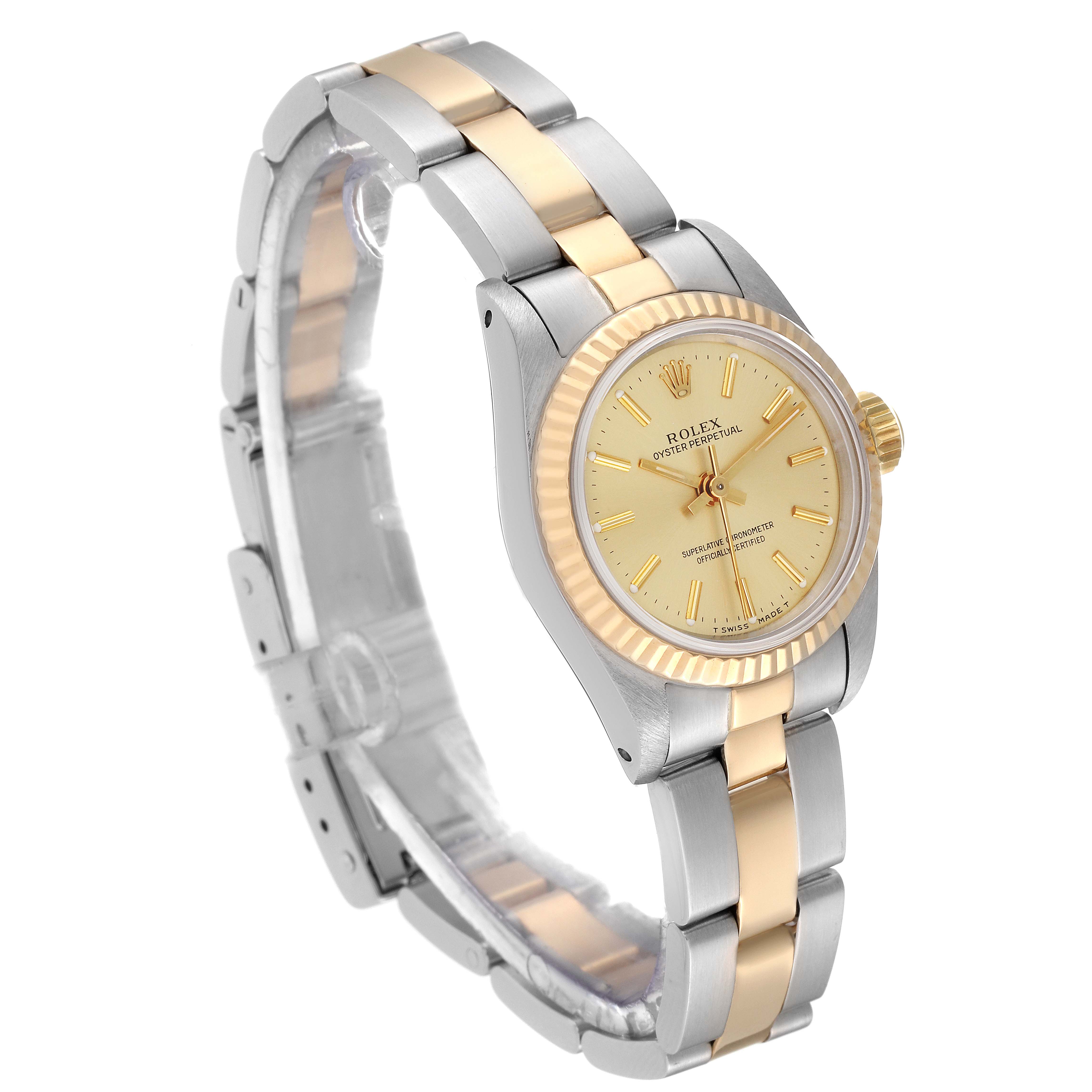 This image shows a side and front view of the Rolex Oyster Perpetual 67193 Women's Steel and Gold (two tone) Champagne Dial 67193 Women's Steel and Gold (two tone) Champagne Dial watch, featuring a bi-metallic bracelet and fluted bezel.