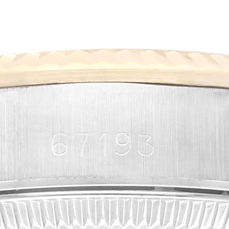 This image shows a close-up angle of the side of a Rolex Oyster Perpetual 67193 Women's Steel and Gold (two tone) Champagne Dial 67193 Women's Steel and Gold (two tone) Champagne Dial watch case, highlighting the model number 67193.