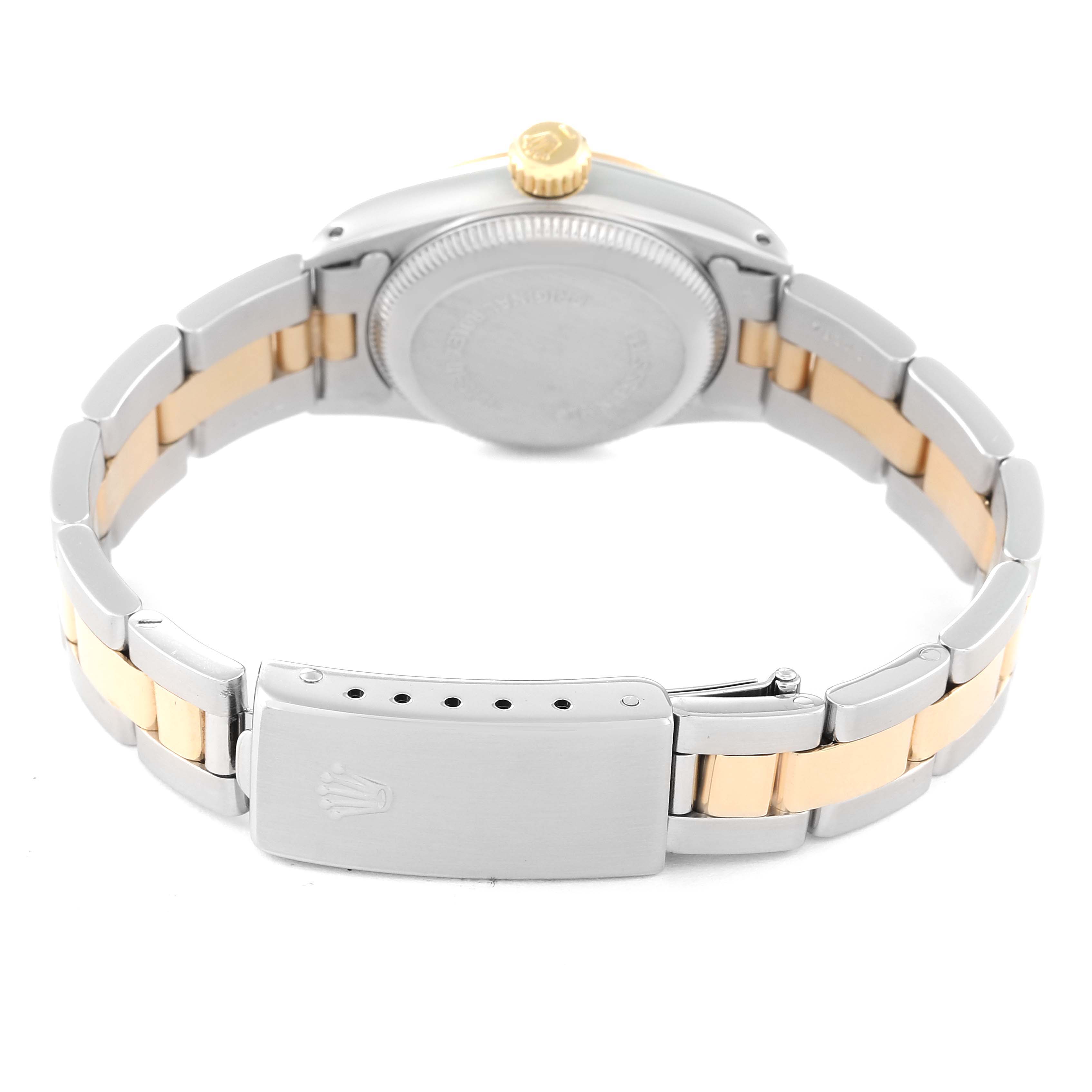 The image shows the back and clasp of a Rolex Oyster Perpetual 67193 Women's Steel and Gold (two tone) Champagne Dial 67193 Women's Steel and Gold (two tone) Champagne Dial watch, highlighting the two-tone bracelet and the engraved clasp.