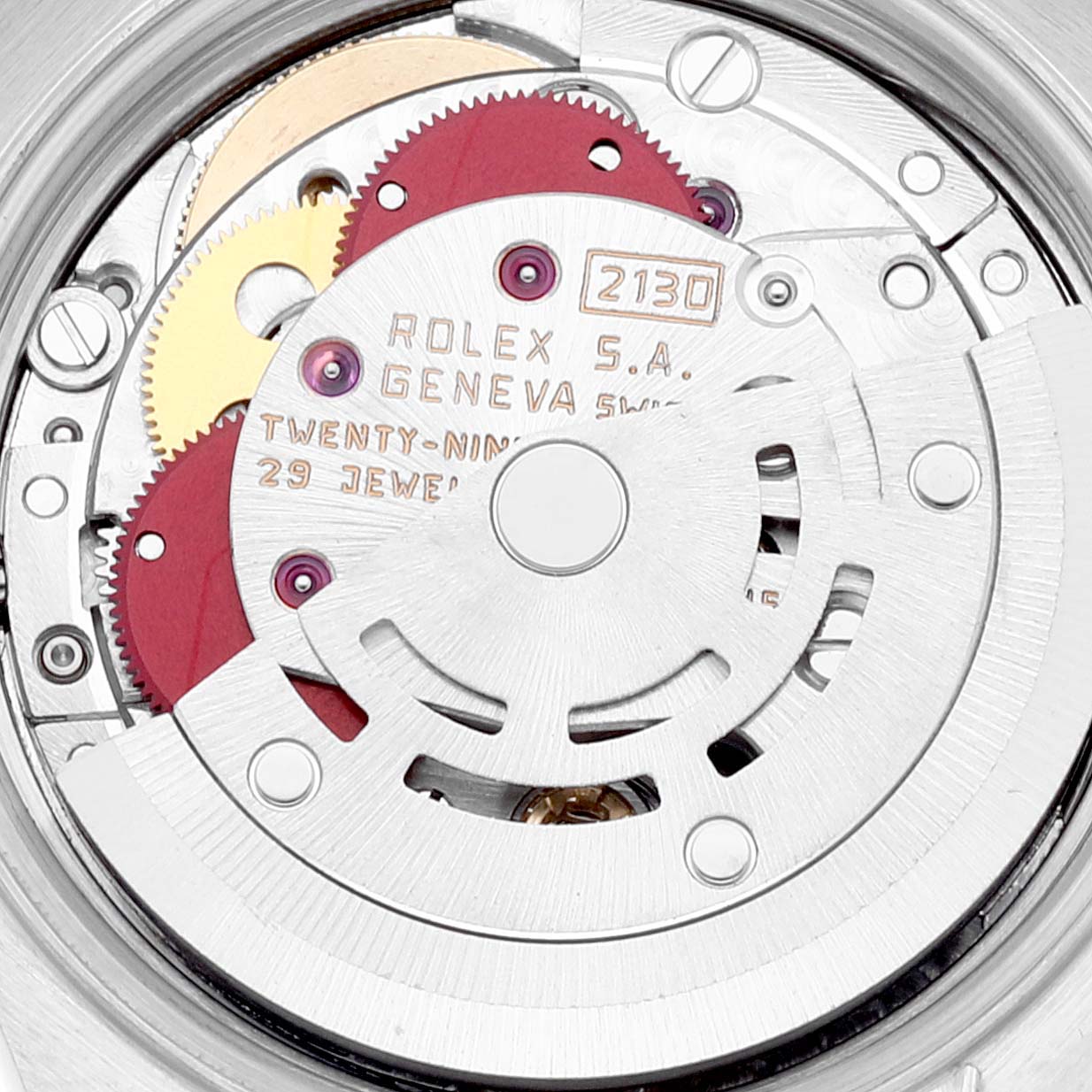 This image shows the movement mechanism inside the Rolex Oyster Perpetual 67183 Women's Steel and Gold (two tone) Grey Dial 67183 Women's Steel and Gold (two tone) Grey Dial watch, highlighting the intricate gears and components.