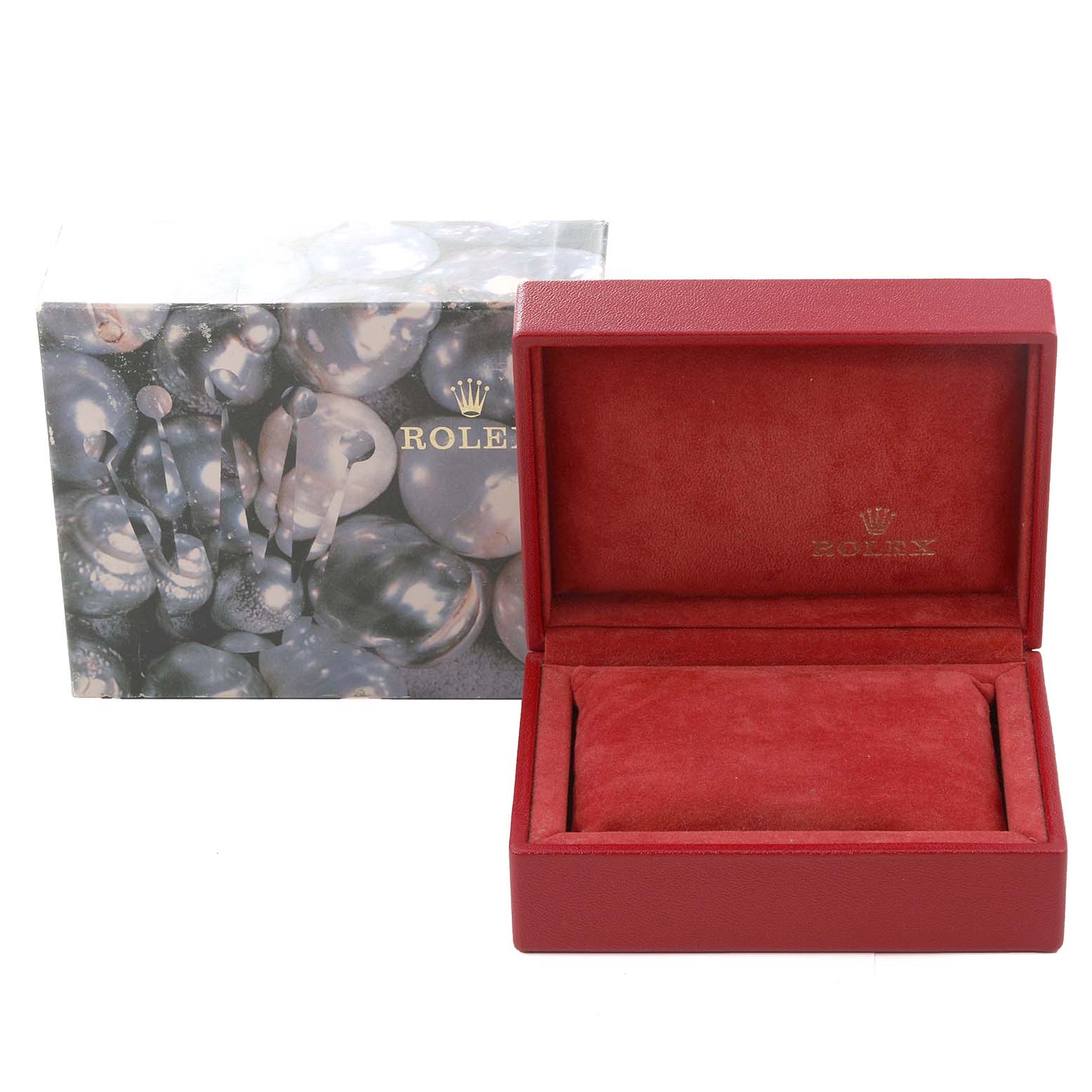 This image shows a Rolex watch box and outer packaging for the Oyster Perpetual model, with the box open and empty.