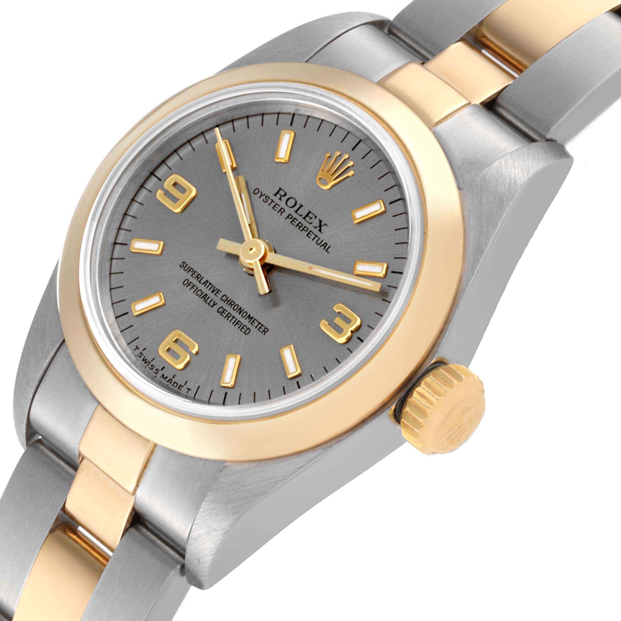 This image shows a close-up of the Rolex Oyster Perpetual 67183 Women's Steel and Gold (two tone) Grey Dial 67183 Women's Steel and Gold (two tone) Grey Dial watch face, crown, and part of the bracelet, viewed at a slight angle.