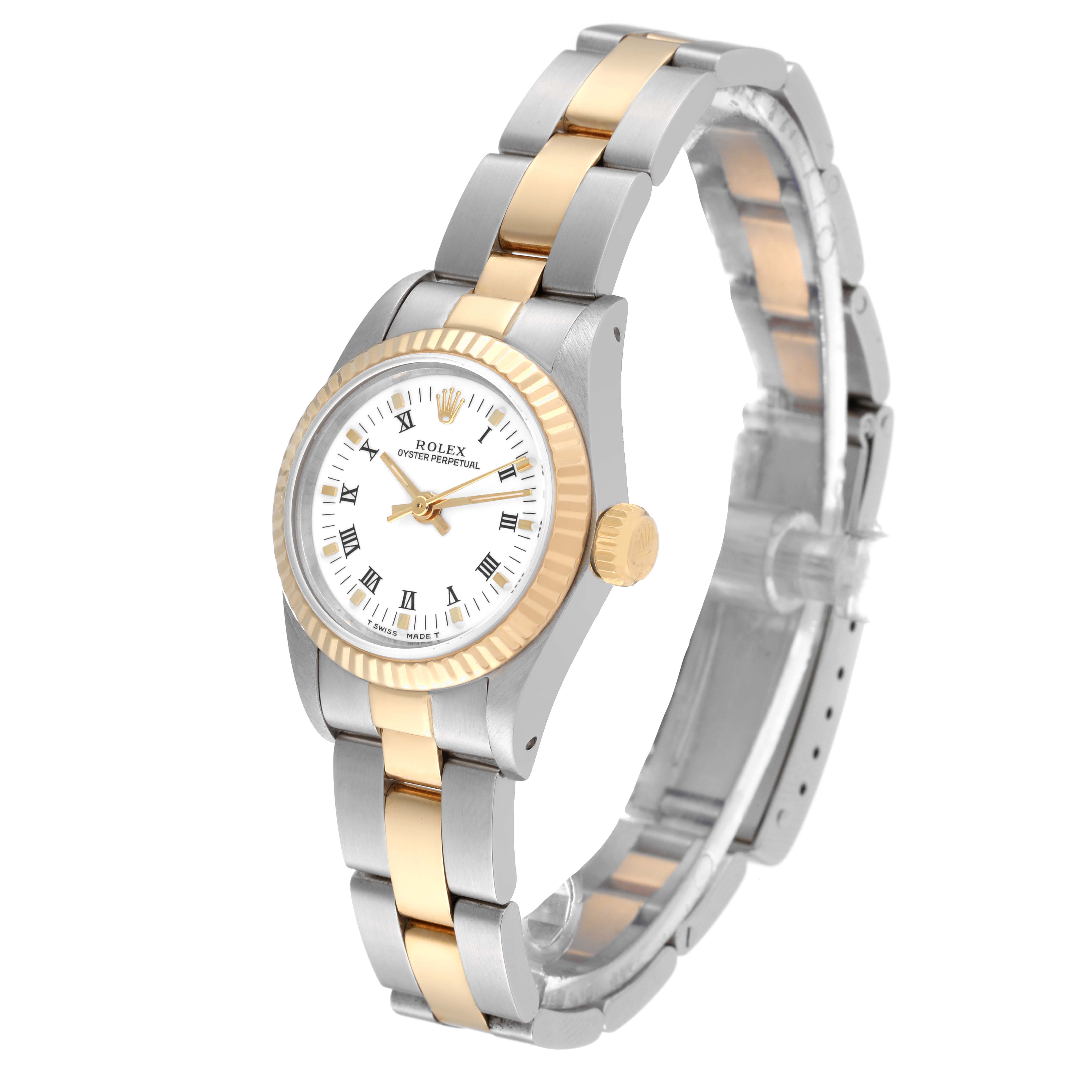 This image shows the Rolex Oyster Perpetual 67193 Women's Steel and Gold (two tone) White Dial 67193 Women's Steel and Gold (two tone) White Dial watch at a three-quarter angle, displaying its face, gold bezel, and two-tone bracelet.