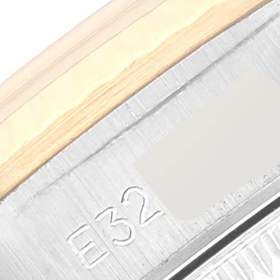 This image is a close-up of the bezel and case edge of a Rolex Oyster Perpetual 67193 Women's Steel and Gold (two tone) White Dial 67193 Women's Steel and Gold (two tone) White Dial watch.