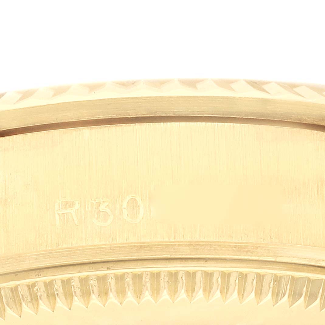 The image shows a close-up of the side case and bezel detailing of a Rolex President 68278 Women's Yellow Gold Champagne Dial 68278 Women's Yellow Gold Champagne Dial watch.