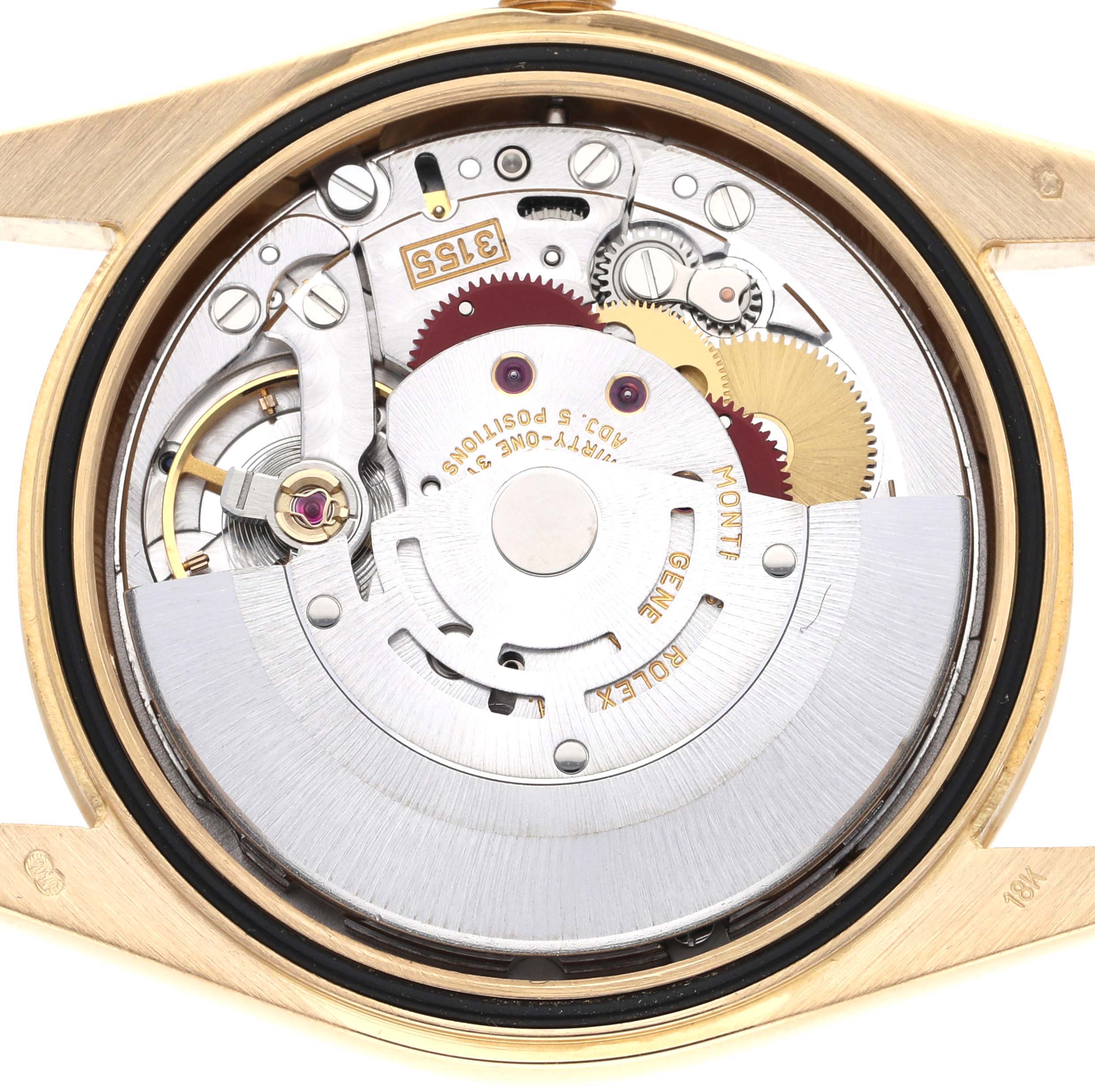 The image shows the back of a Rolex President 118238 Men
s Yellow Gold Champagne Dial watch with an exposed movement, displaying gears and the rotor.