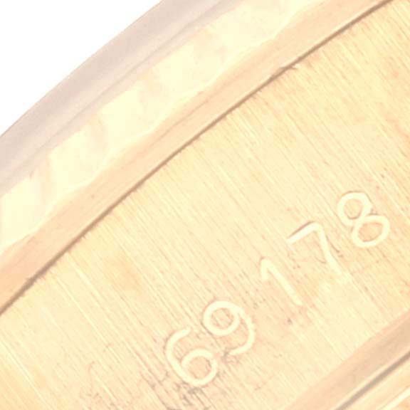 This close-up image shows the engraved serial/model number on the case of a Rolex President 69178 Women's Yellow Gold Champagne Dial 69178 Women's Yellow Gold Champagne Dial watch.