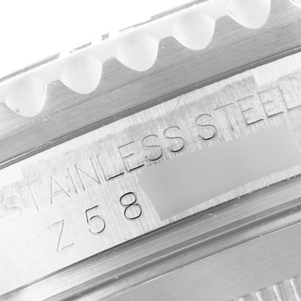 This image shows a close-up of the bezel and case edge of a Rolex Submariner 16610 Men
s Stainless Steel Black Dial 16610 Men
s Stainless Steel Black Dial watch, highlighting "STAINLESS STEEL".