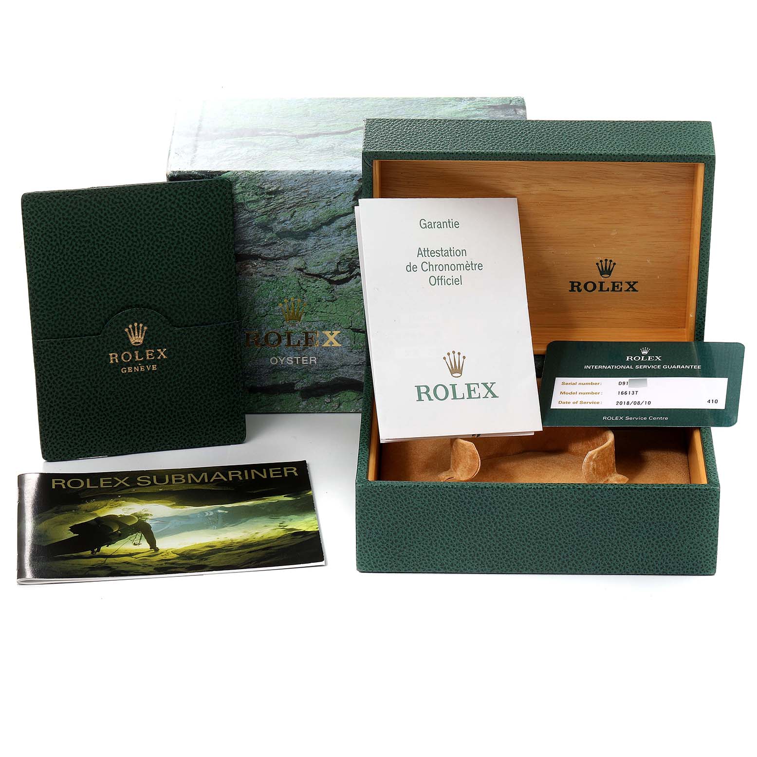 The image shows the packaging and accessories for a Rolex Submariner 16613 Men's Steel and Gold (two tone) Black Dial 16613 Men's Steel and Gold (two tone) Black Dial, including the box, booklets, and warranty card.