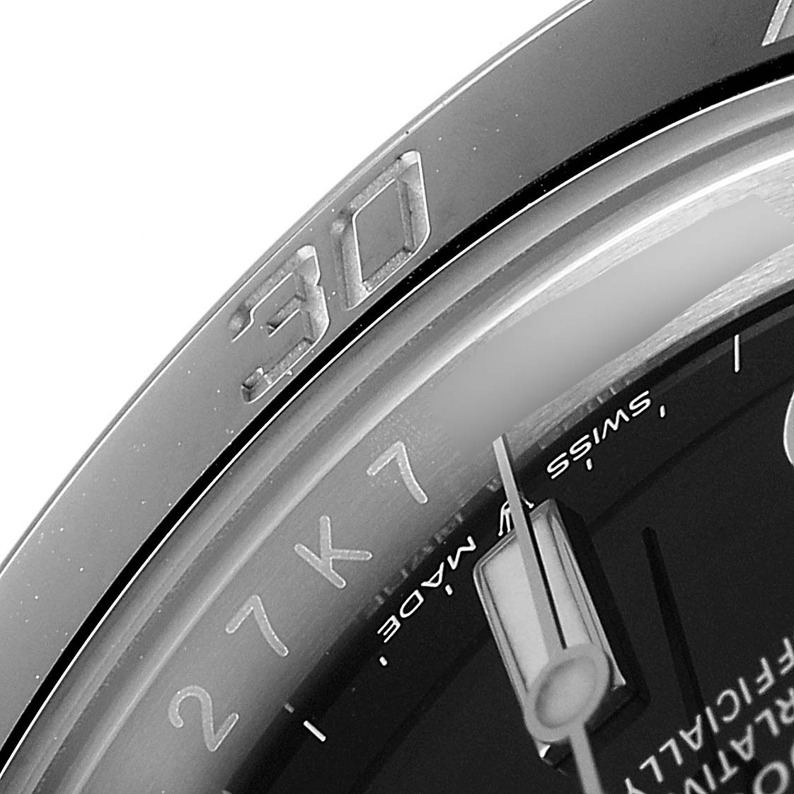 This close-up image of the Rolex Submariner 124060 Men
s Stainless Steel Black Dial 124060 Men
s Stainless Steel Black Dial watch shows the bezel, part of the crystal, and a portion of the dial.