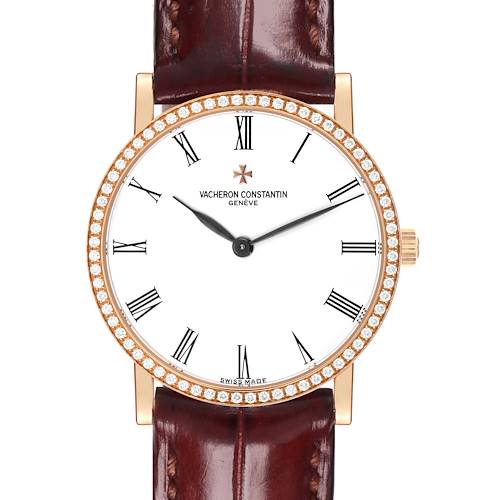 The Vacheron Constantin Traditionnelle watch is shown from the front, featuring its face, bezel, and leather strap.