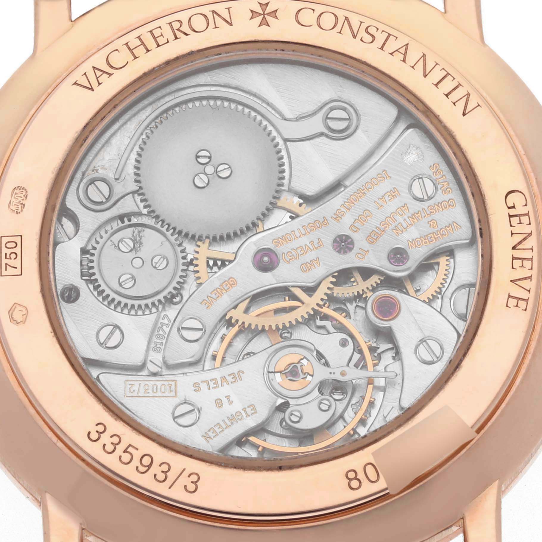 The image shows a rear view of the Vacheron Constantin Traditionnelle 33593/3 Women's Rose Gold White Dial 33593/3 Women's Rose Gold White Dial watch, highlighting the intricate movement and gears.
