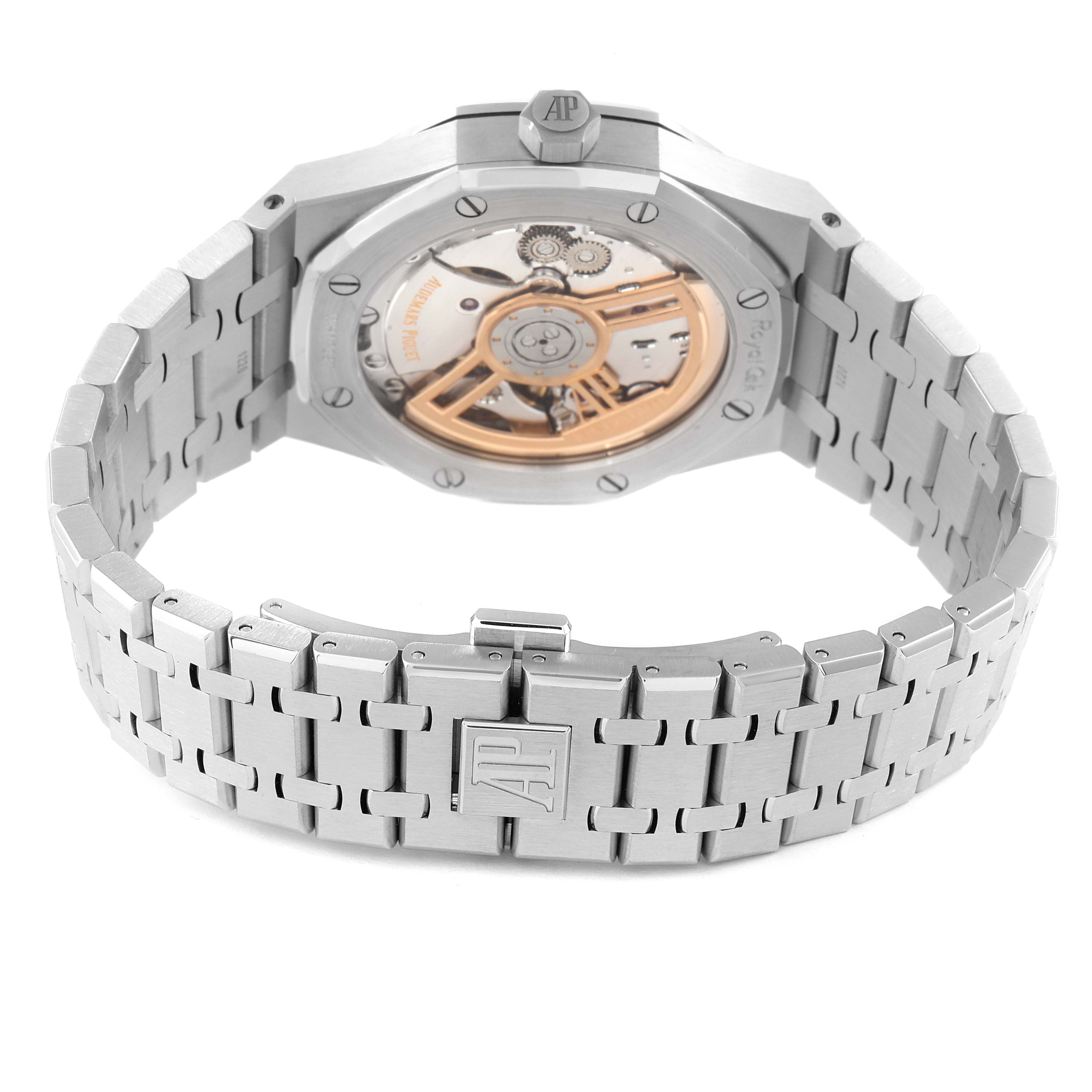 This image shows the back view of a Royal Oak by Audemars Piguet, highlighting the open case back and metal bracelet with a clasp.