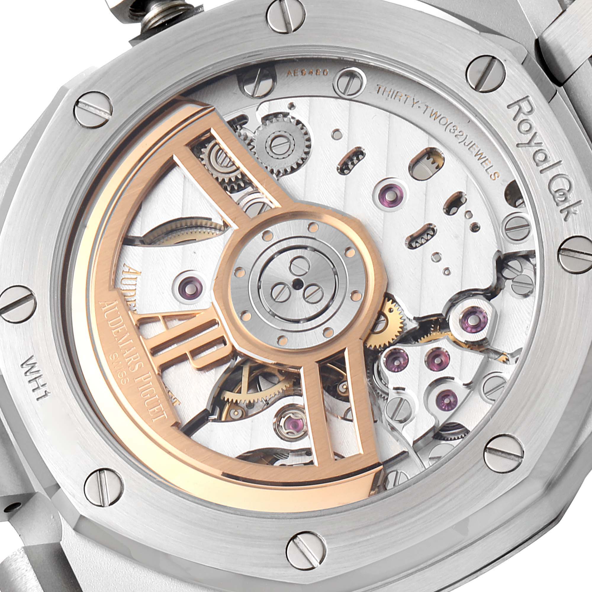 The image shows the back view of a Royal Oak watch by Audemars Piguet, highlighting its intricate mechanical movement.