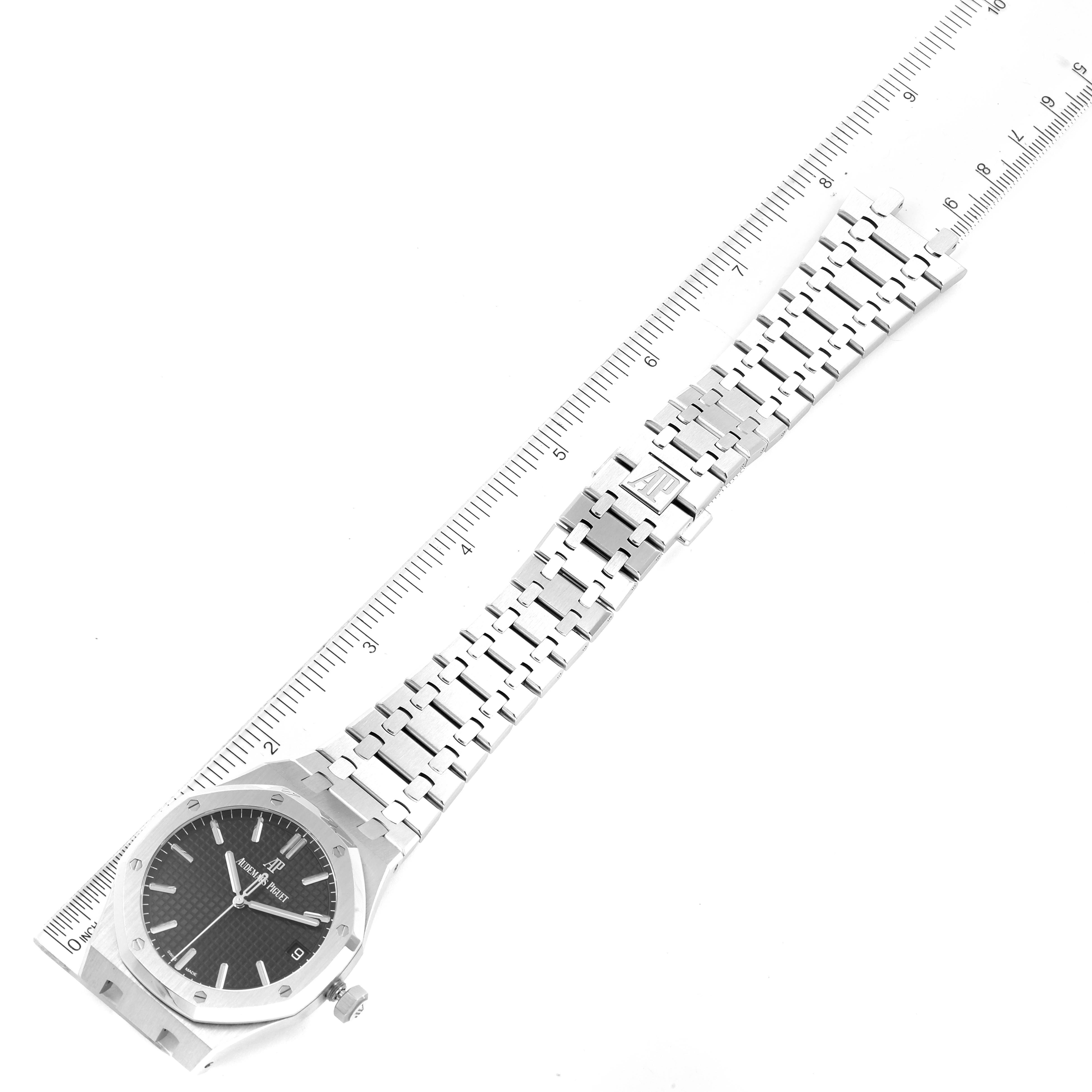 This image shows an Audemars Piguet Royal Oak 15500ST.OO.1220ST.03 Men's Stainless Steel Black Dial 15500ST.OO.1220ST.03 Men's Stainless Steel Black Dial watch, highlighting its dial, bracelet, and clasp, positioned alongside a ruler.