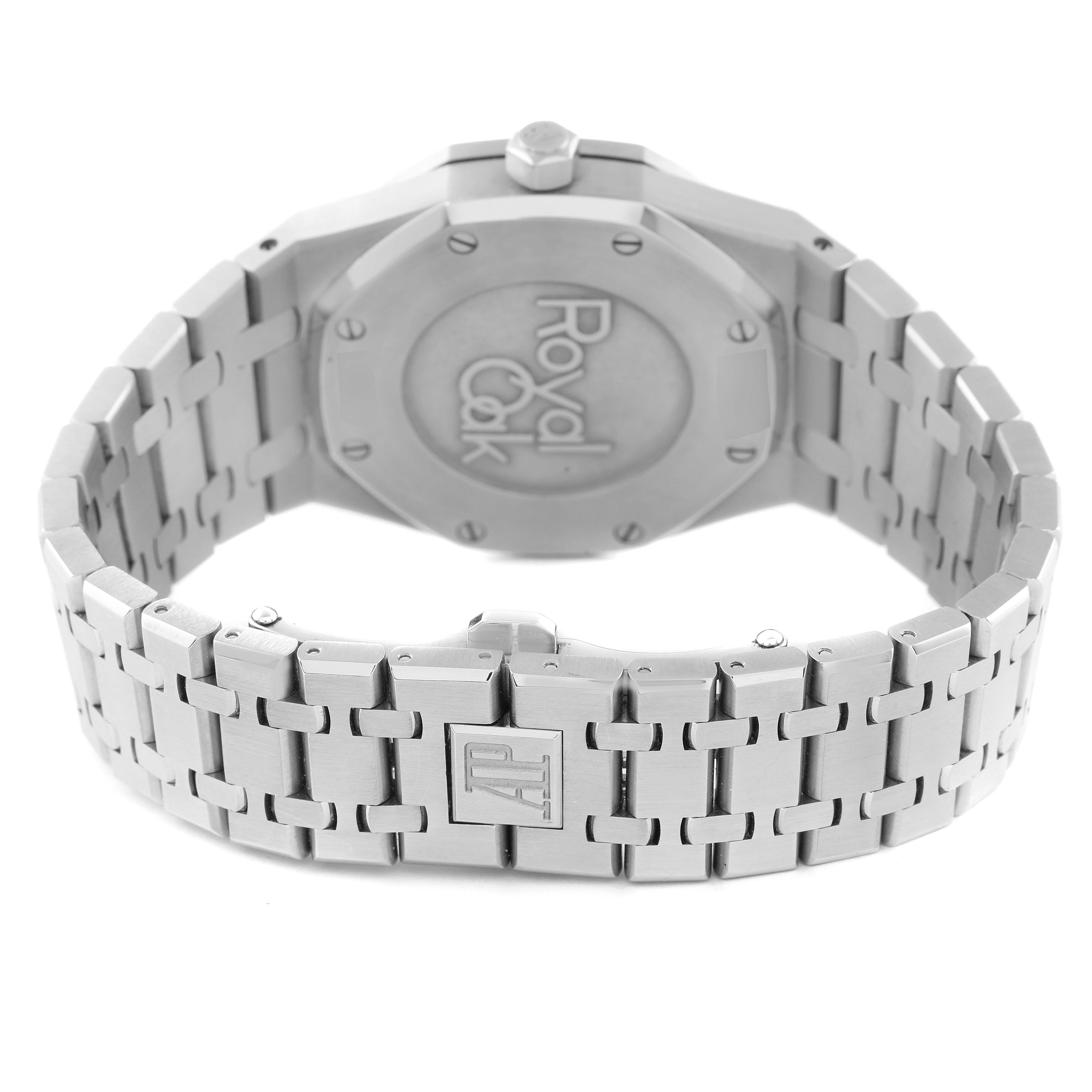 This image shows the back case and bracelet of a Royal Oak model by Audemars Piguet, highlighting the "Royal Oak" engraving and logo clasp.