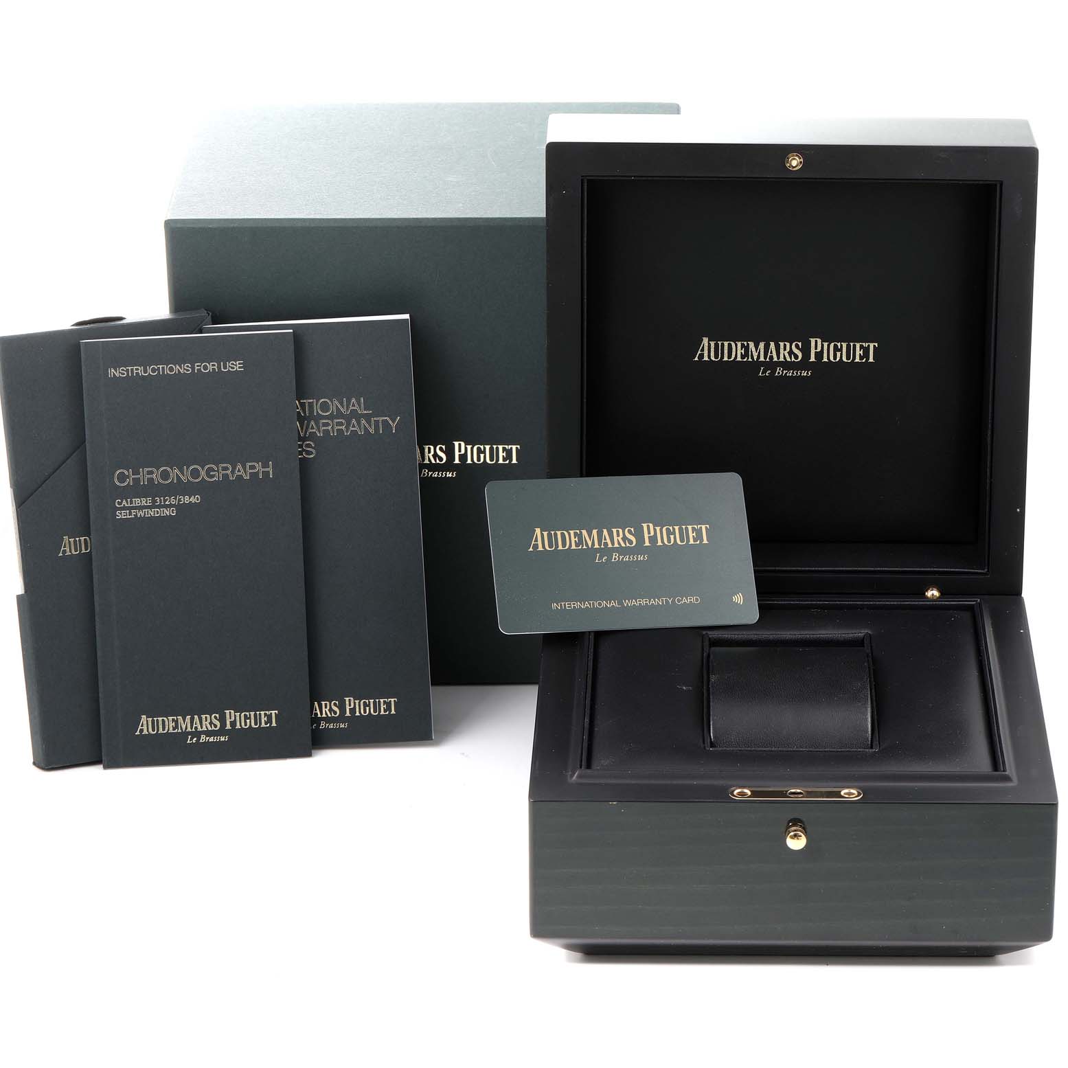 The image shows the packaging and documentation for an Audemars Piguet Royal Oak Offshore 26405CE.OO.A002CA.02 Men's Ceramic Black Dial 26405CE.OO.A002CA.02 Men's Ceramic Black Dial watch, including its box and warranty card.