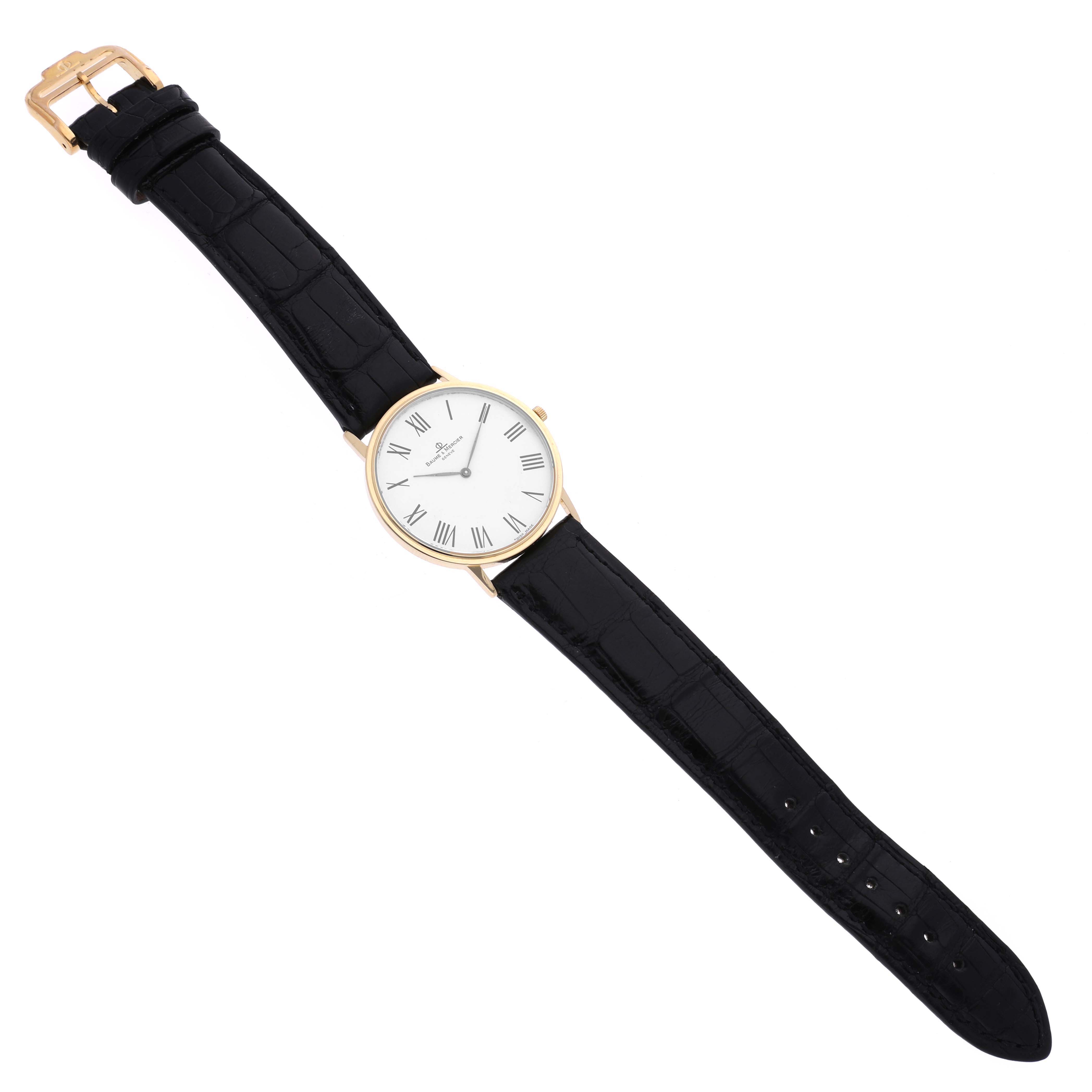 The Classima watch by Baume & Mercier is shown at an angled top view, displaying the entire watch face, strap, and buckle.