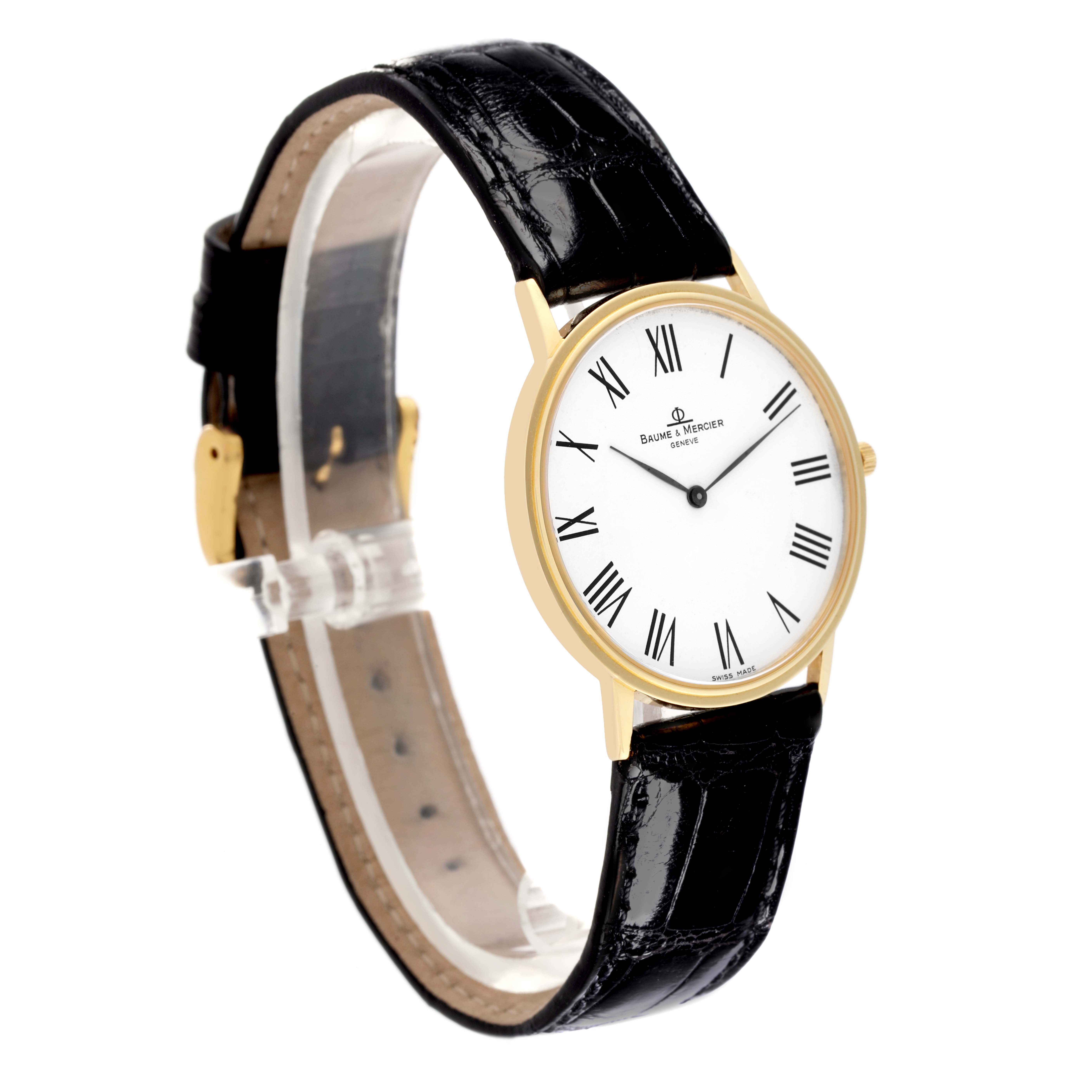 The Baume & Mercier Classima MV045088 Men's Yellow Gold White Dial MV045088 Men's Yellow Gold White Dial watch is shown at a three-quarter angle, highlighting the dial, gold case, and black leather strap.