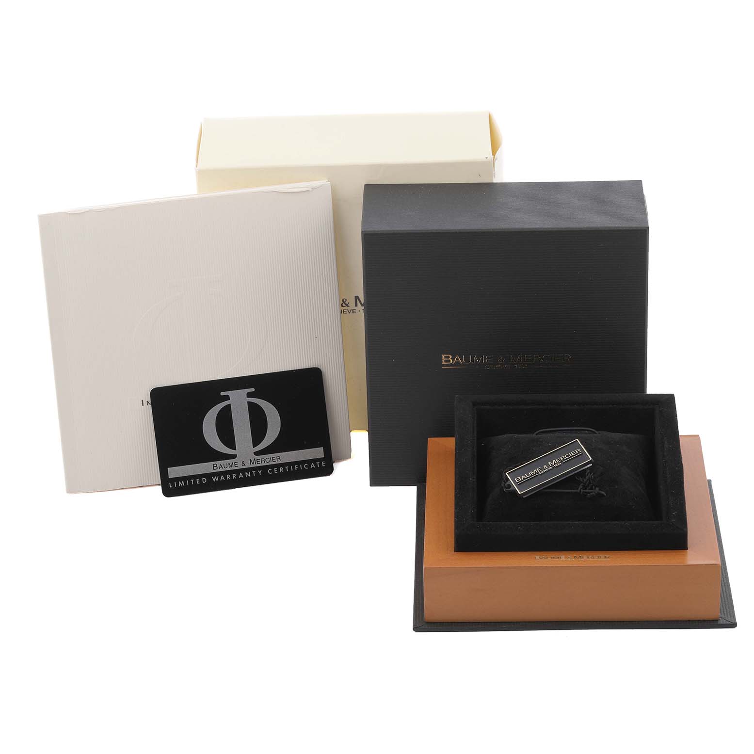 The image shows the packaging and warranty card for the Baume & Mercier Classima MV045088 Men's Yellow Gold White Dial MV045088 Men's Yellow Gold White Dial watch, including boxes and paperwork.