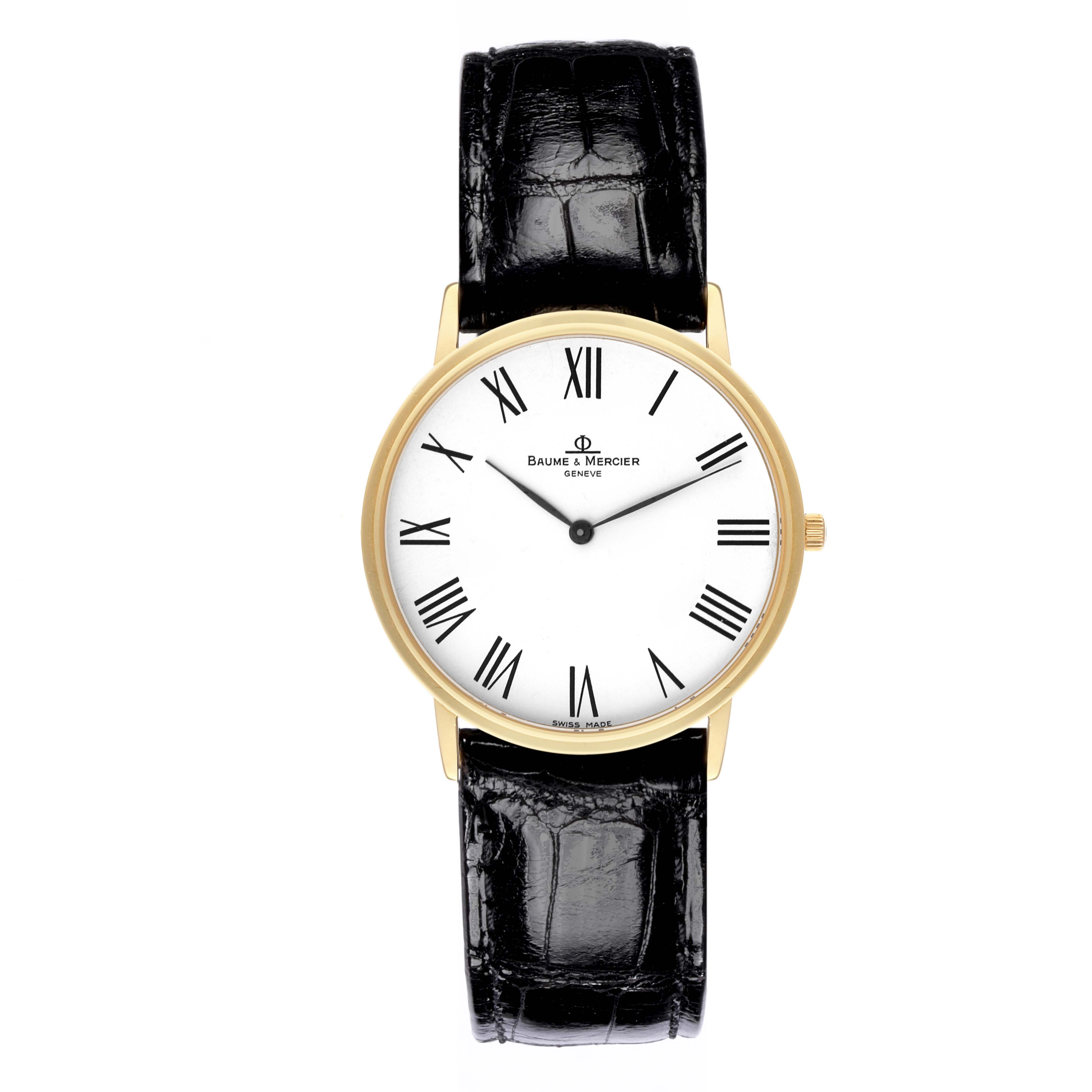 The Baume & Mercier Classima MV045088 Men's Yellow Gold White Dial MV045088 Men's Yellow Gold White Dial watch is shown from a top-down angle, displaying its face, Roman numerals, and black leather strap.