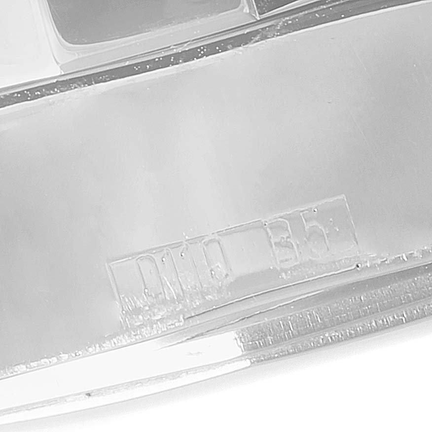 This image shows a close-up view of the side of the Colt model watch by Breitling, highlighting part of the casing detail.