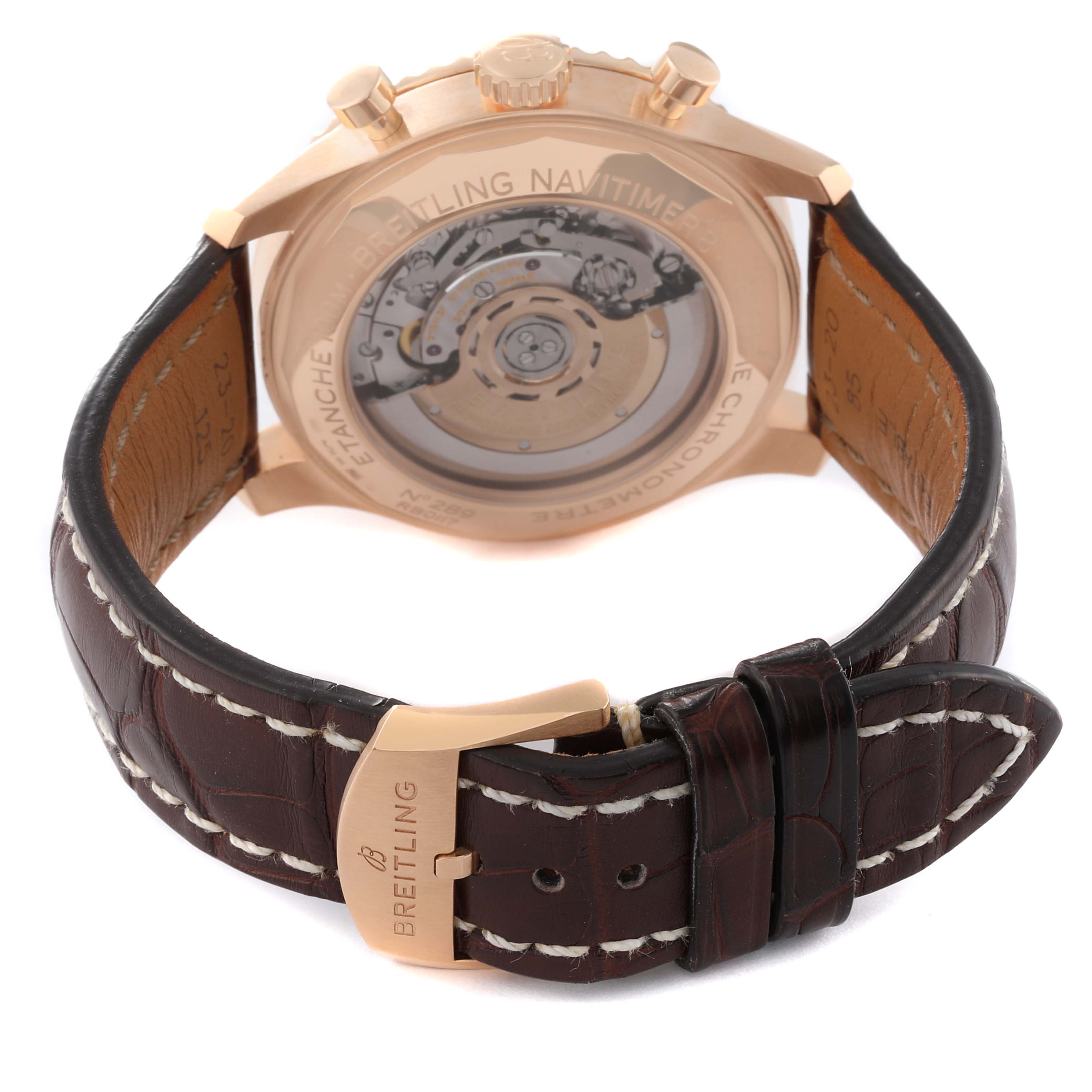 The image shows the back view of the Breitling Navitimer watch, highlighting the movement and leather strap.