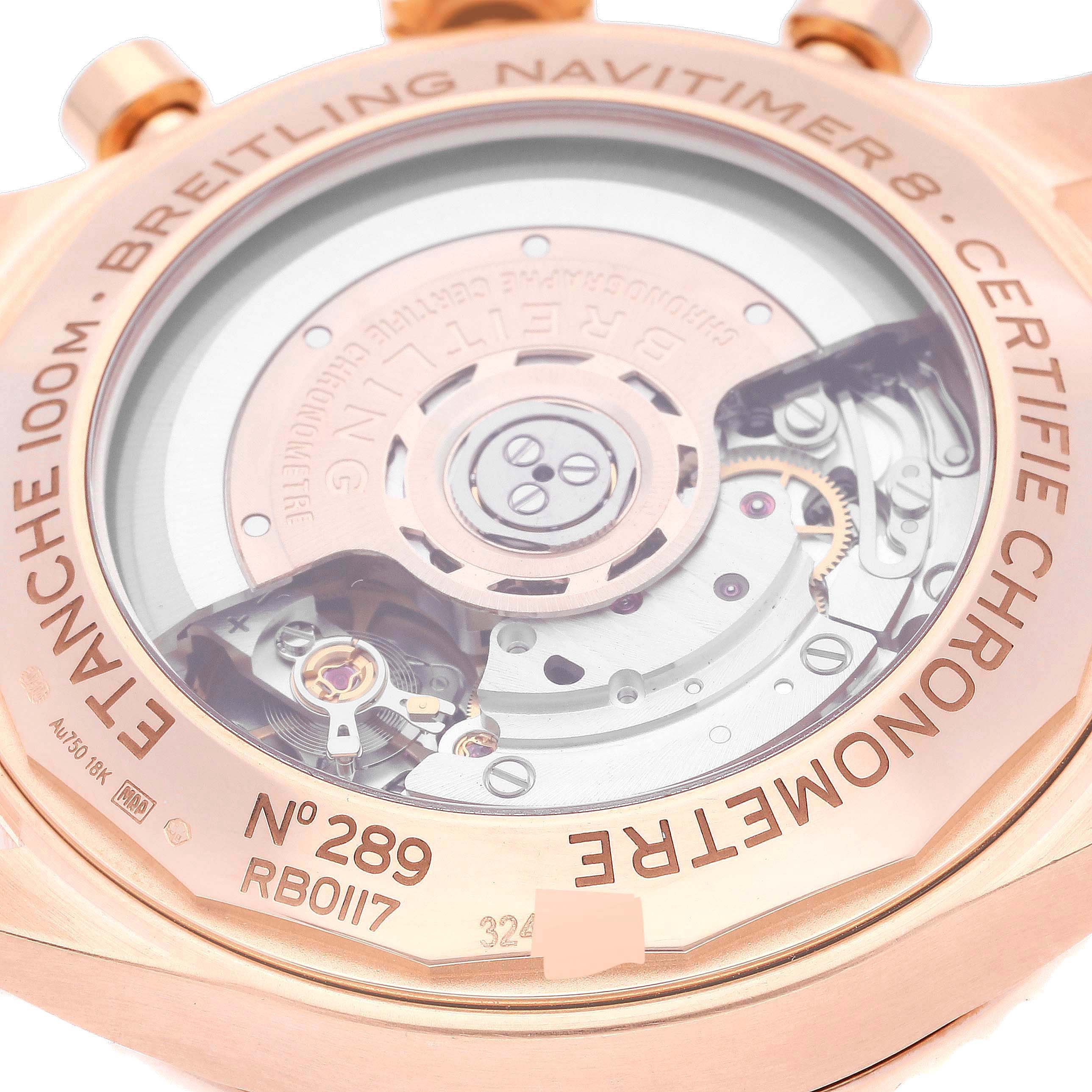 The image shows a close-up view of the back case and movement of a Breitling Navitimer watch.