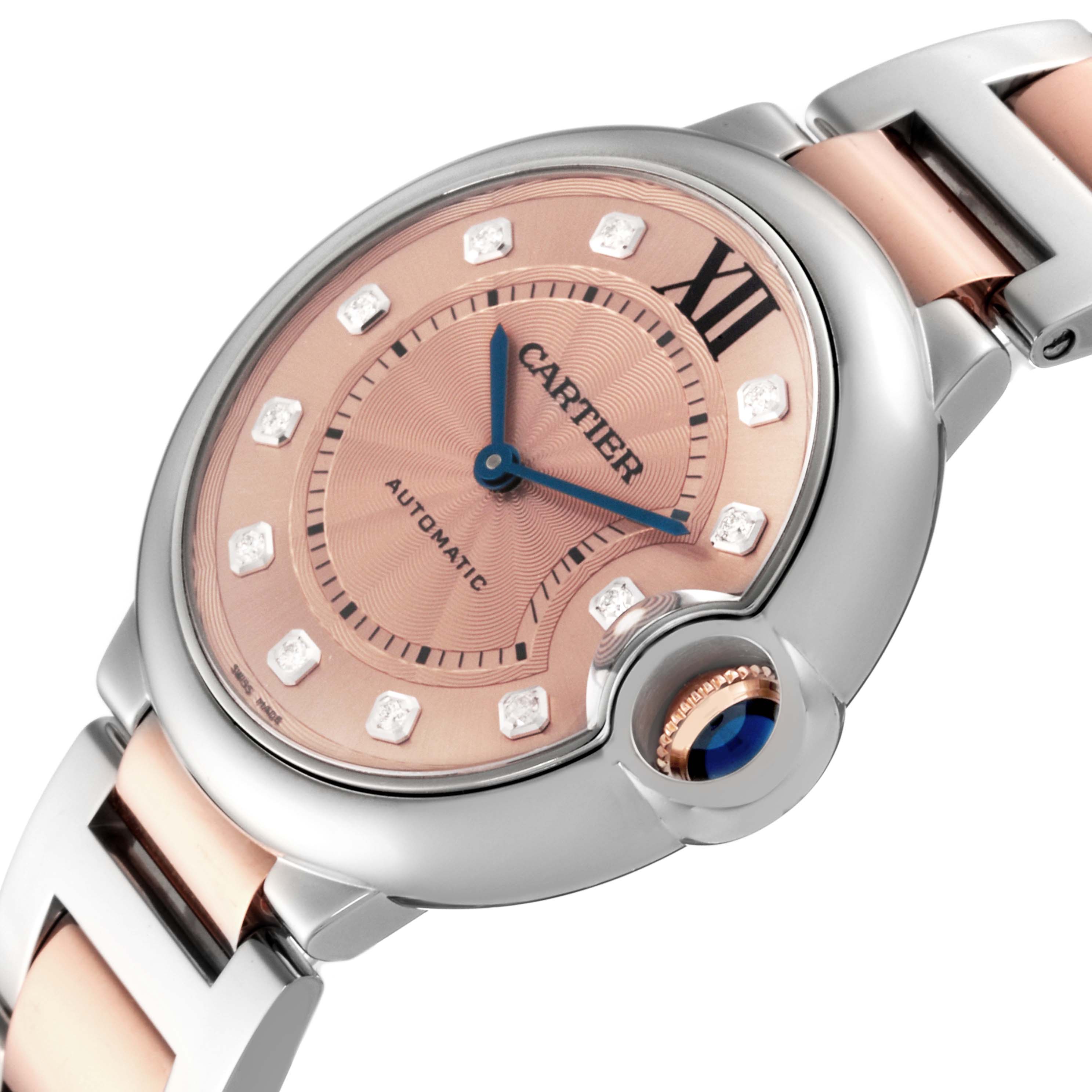 The Cartier Ballon Bleu WE902054 Women's Steel and Gold (two tone) Pink Dial WE902054 Women's Steel and Gold (two tone) Pink Dial watch is shown at an angled view highlighting the dial, crown, and part of the bracelet.
