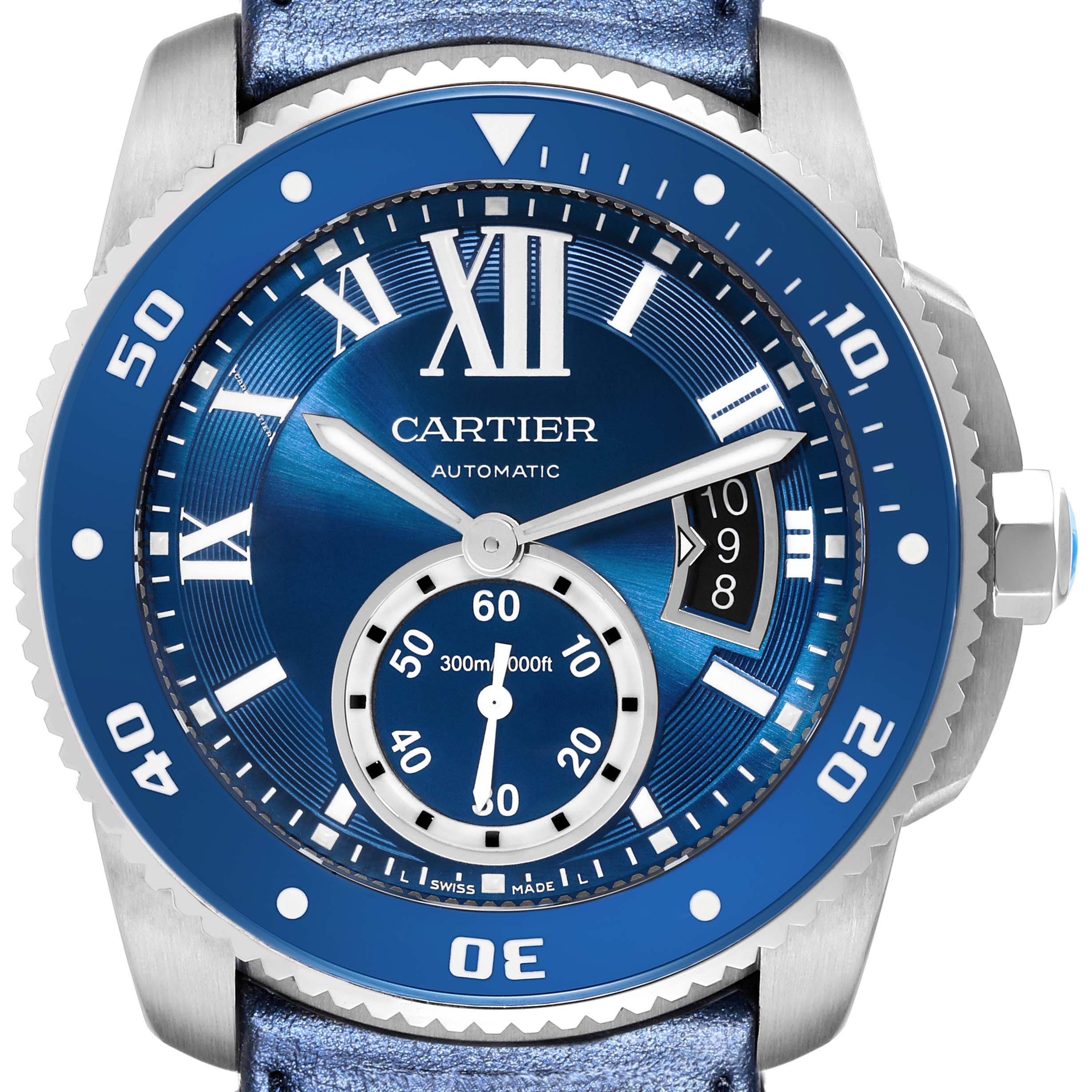 The image shows a front view of the Calibre de Cartier watch, highlighting its blue dial, bezel, and date display.