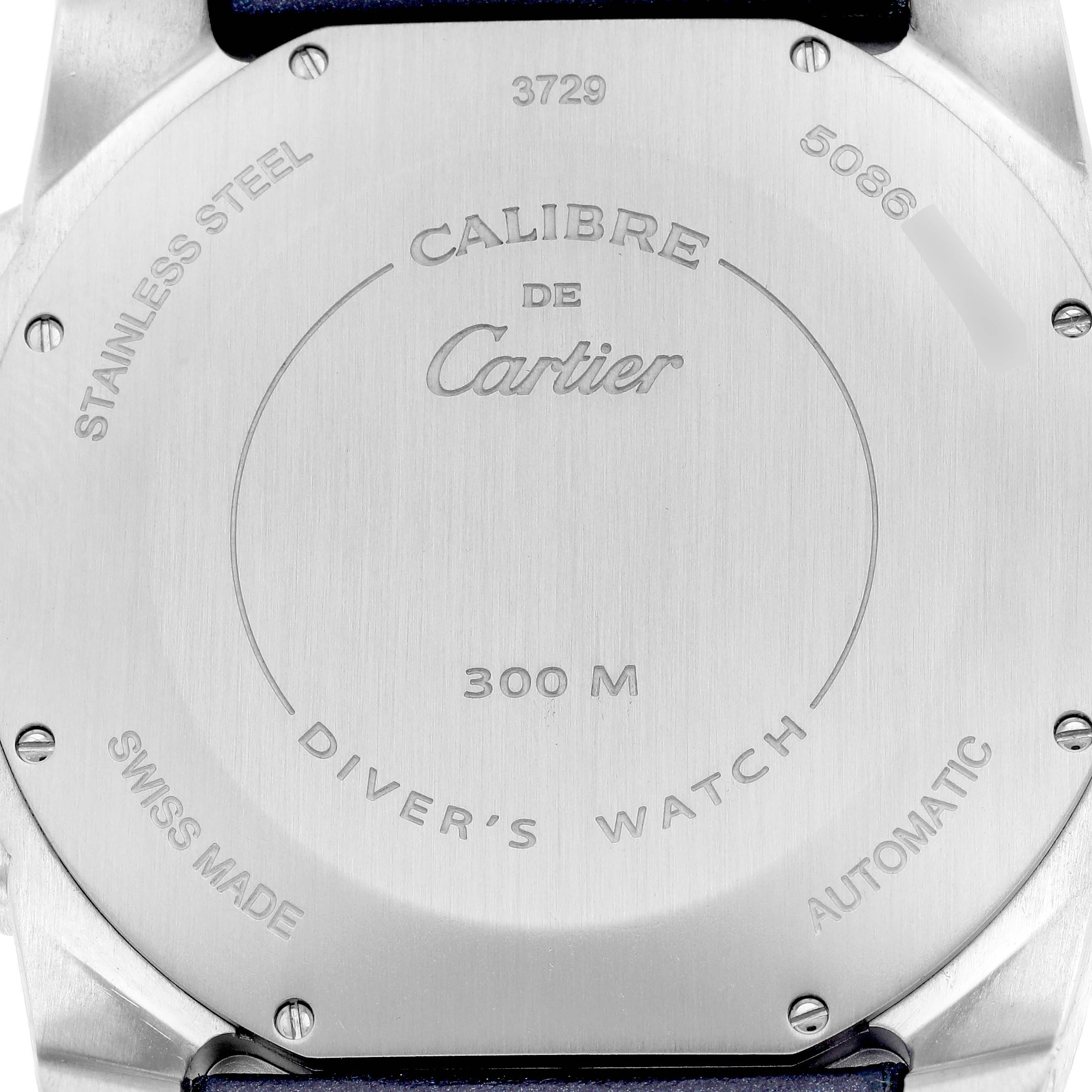 The image shows the back case of the Calibre de Cartier watch, highlighting its stainless steel design and markings.