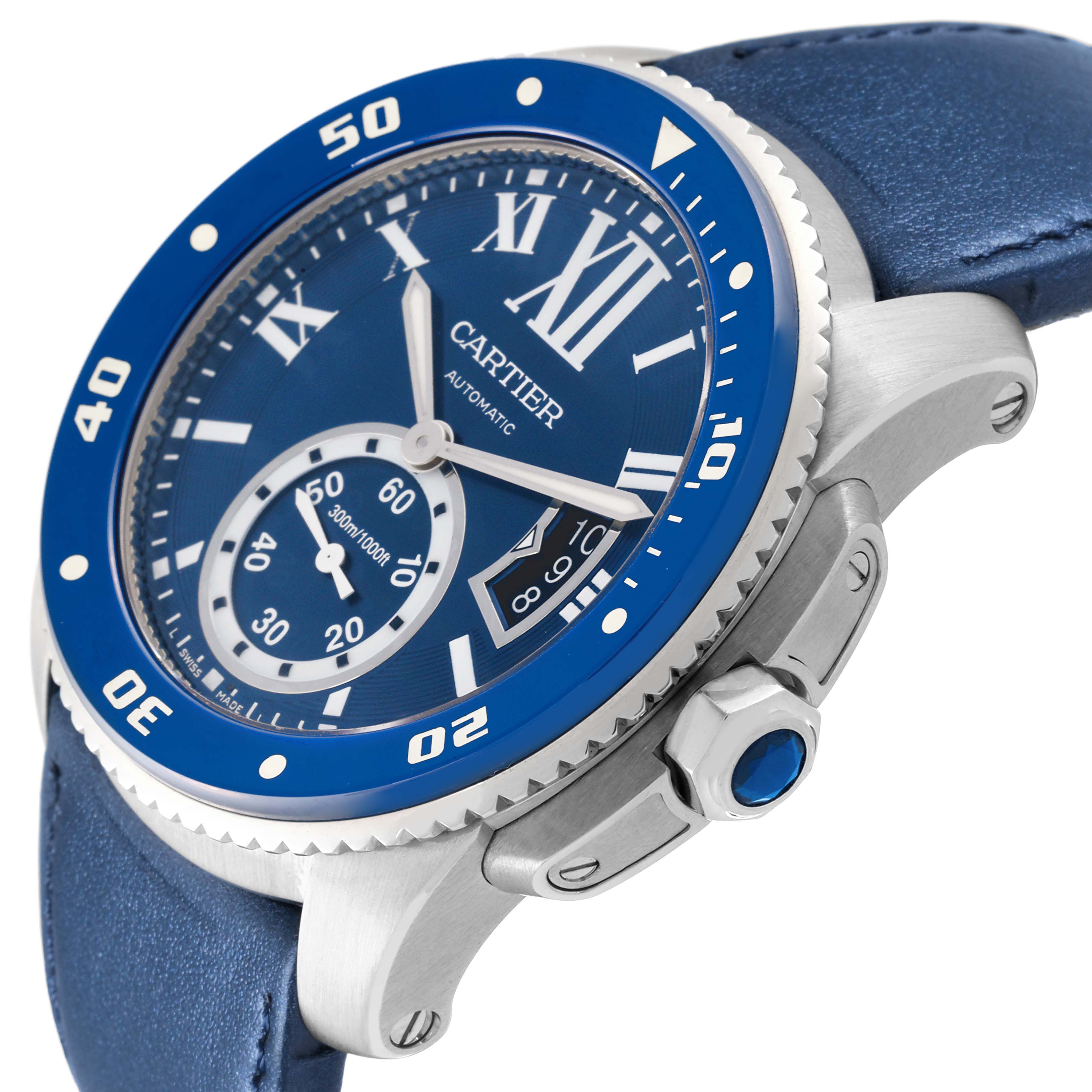 The Calibre de Cartier watch is shown at a slight side angle, highlighting the blue bezel, crown, and part of the strap.