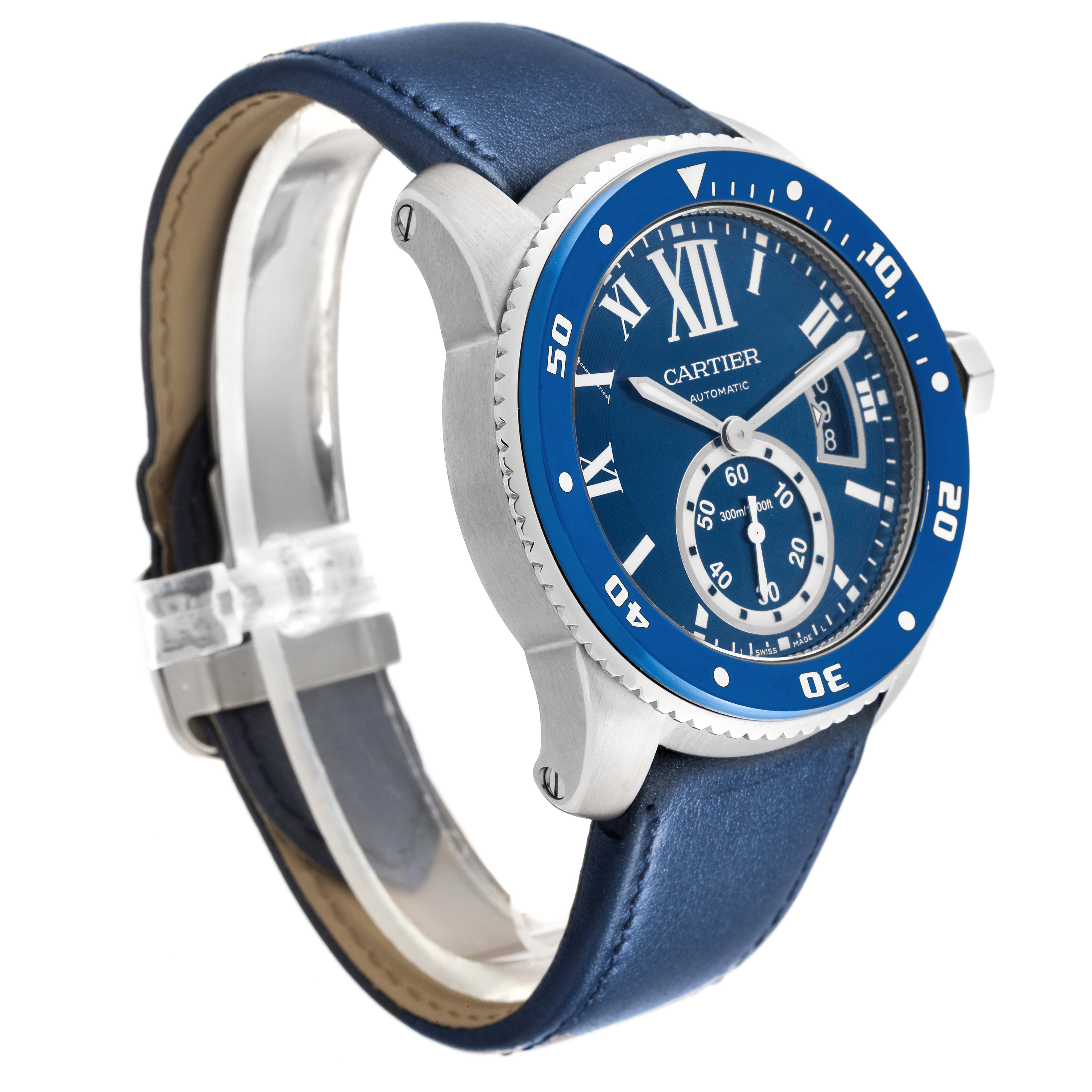 The Calibre de Cartier watch is shown at a three-quarter angle, displaying its face, bezel, and blue leather strap.