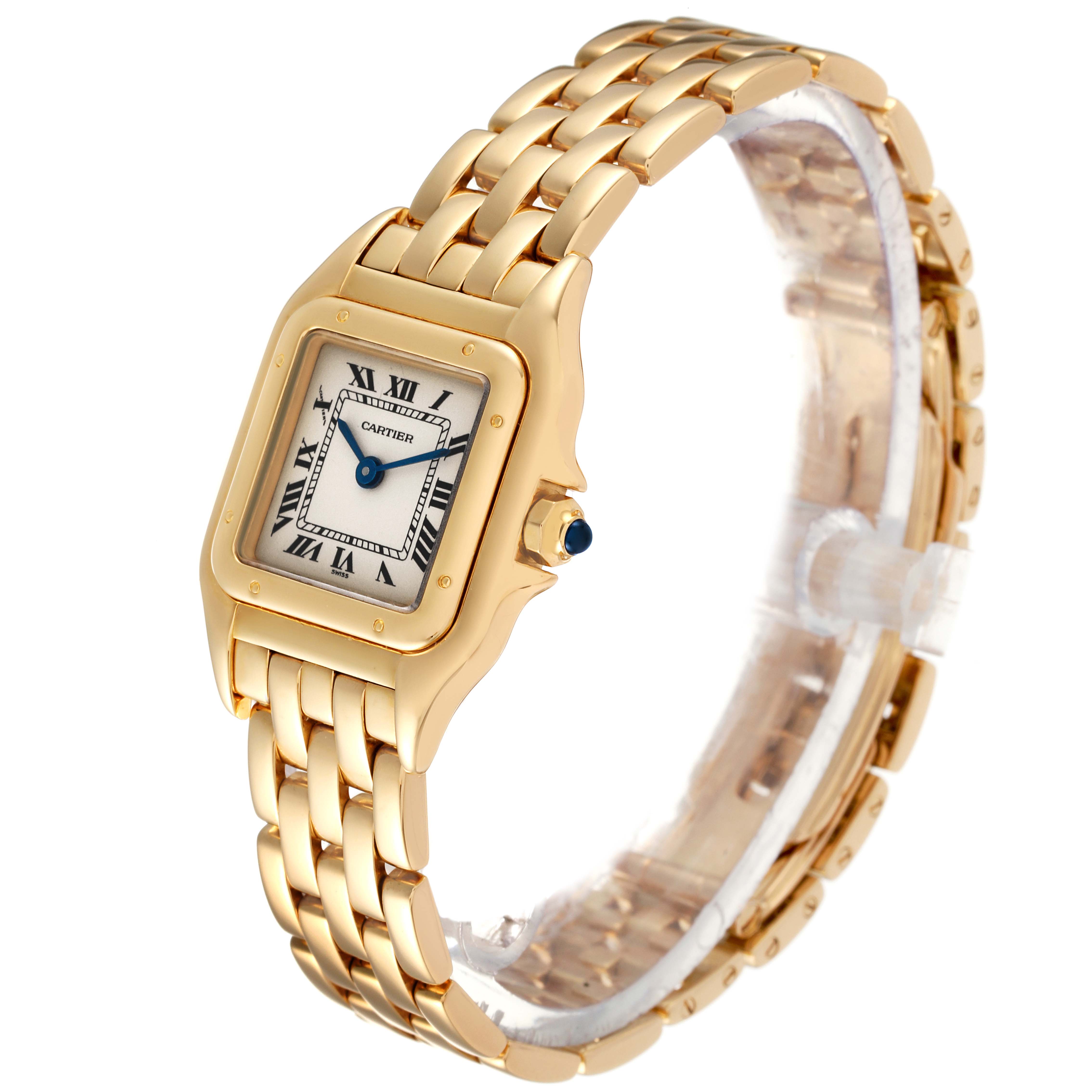 The image shows a Panthere de Cartier watch at a slight angle, revealing the gold bracelet, square face, and blue cabochon crown.