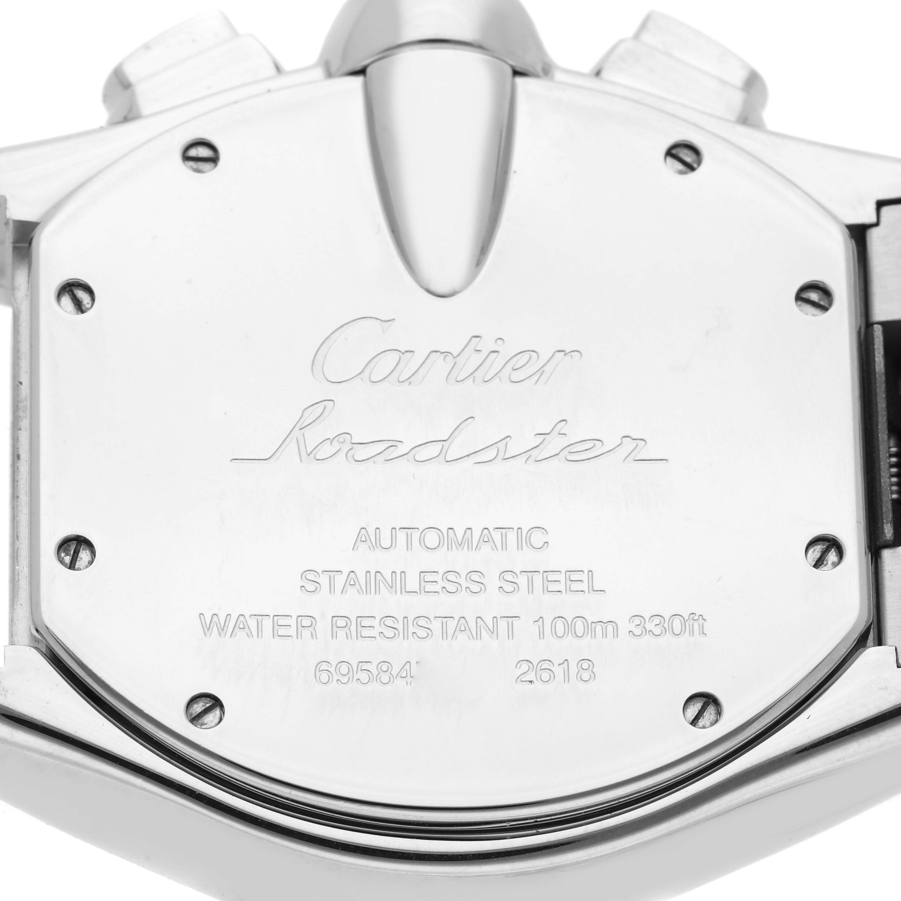 The image shows the back case of a Cartier Roadster W62027Z1 Men's Steel and Gold (two tone) Silver Dial watch, displaying engraved details and screws.
